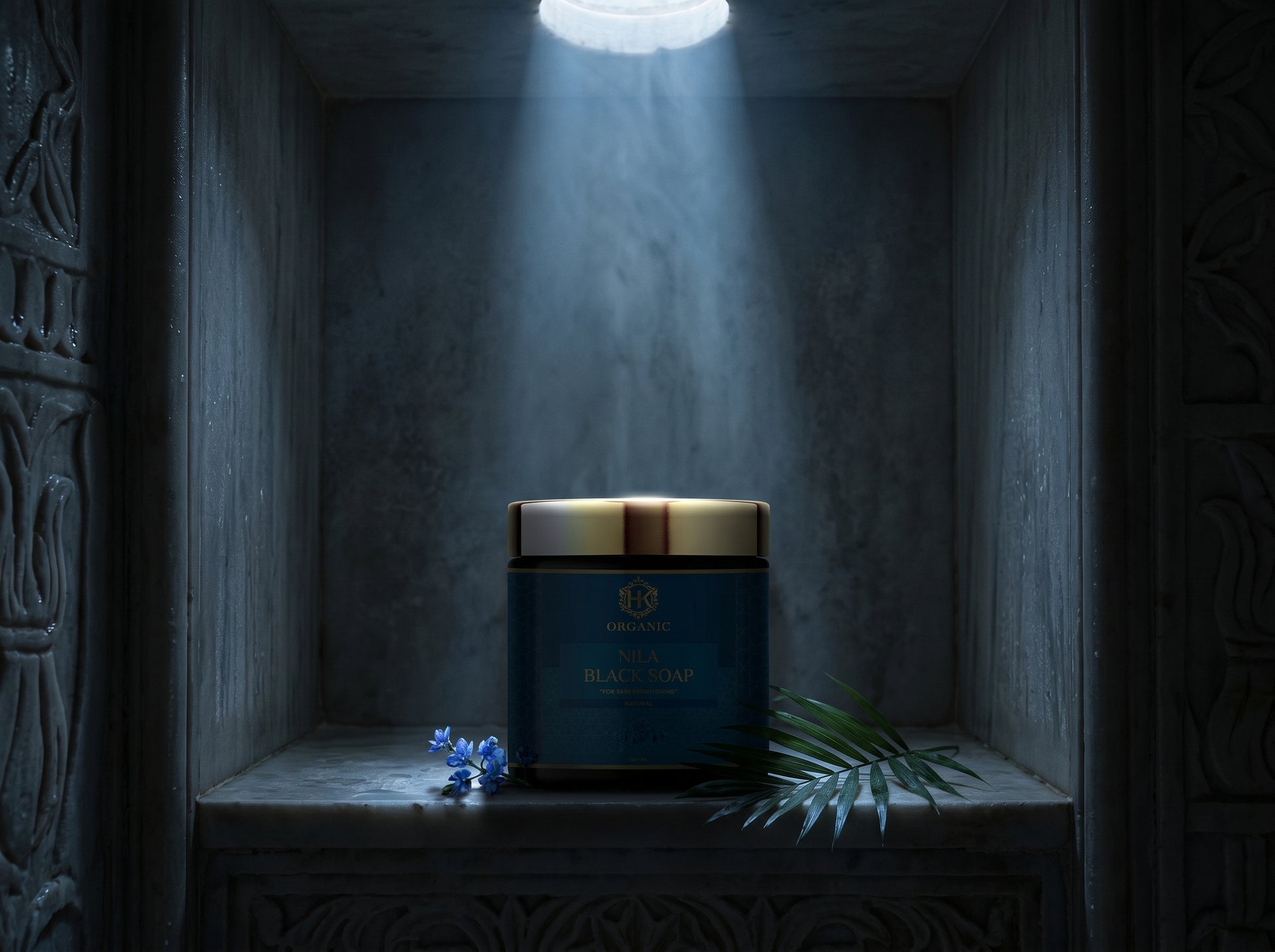 Candle in a decorative holder on a shelf with a spotlight effect