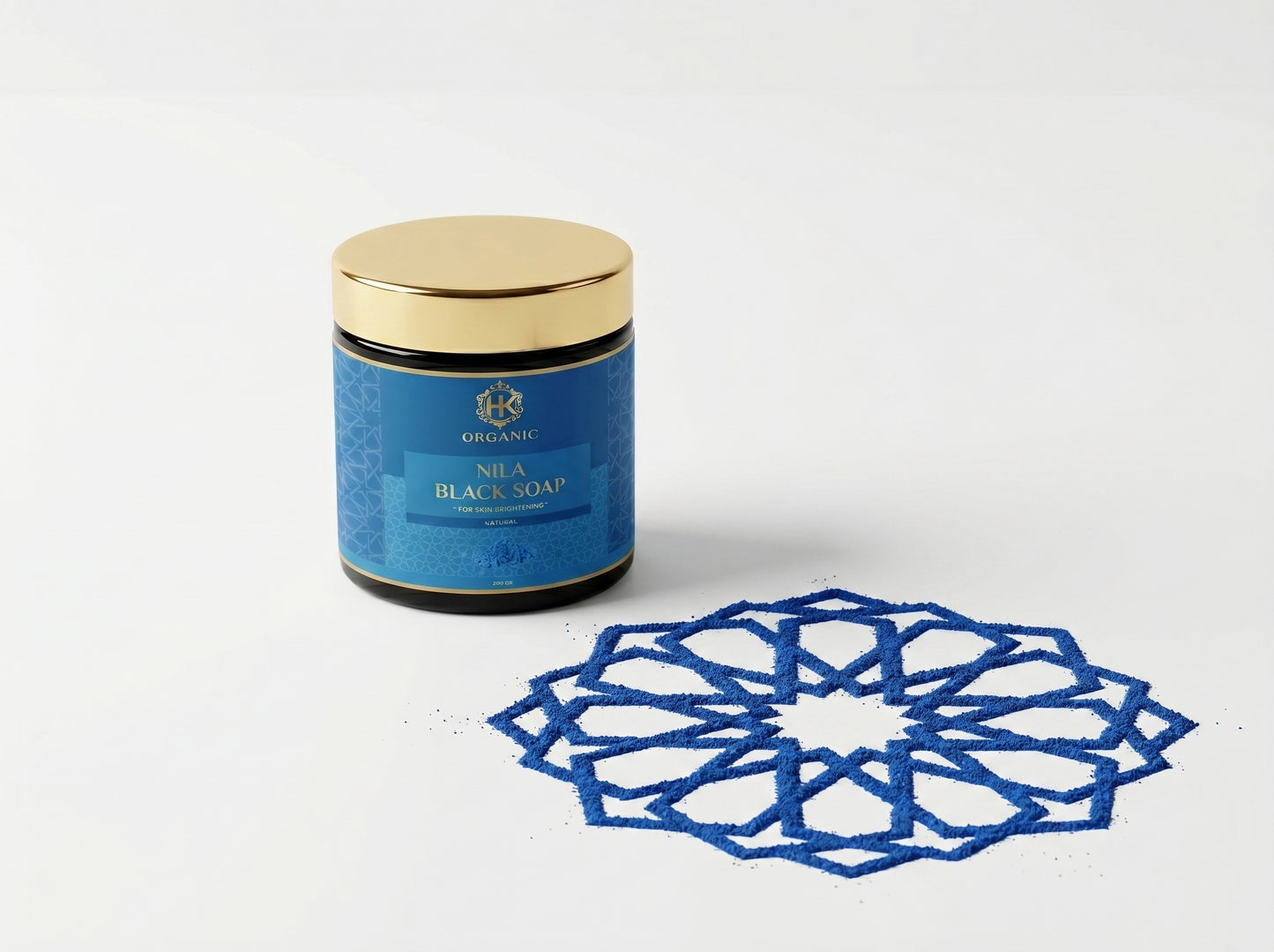 Blue jar of Nila Black Soap with decorative blue pattern on a white background