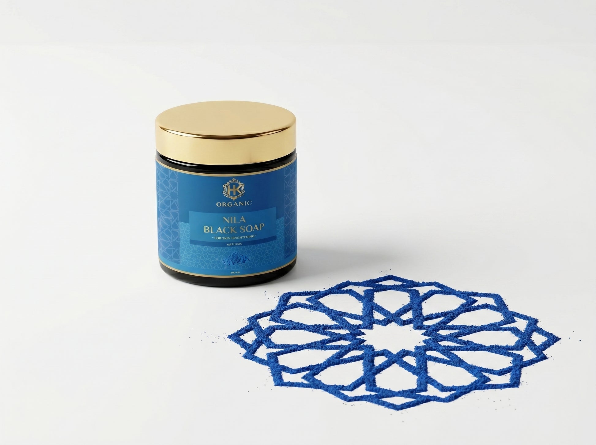 Blue jar of Nila Black Soap with decorative blue pattern on a white background