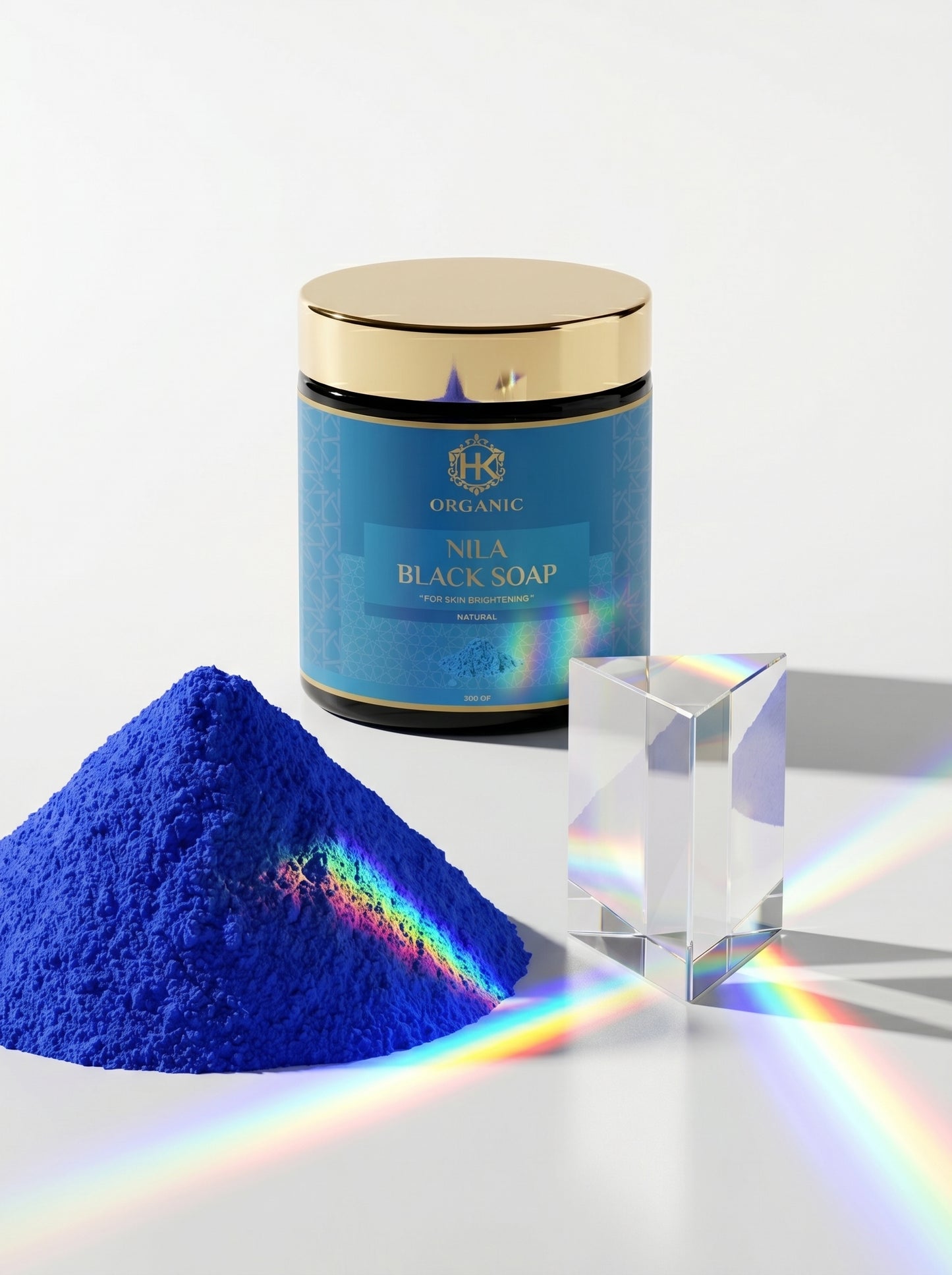 Blue powder with a container labeled 'Nila Black Soap' on a white background