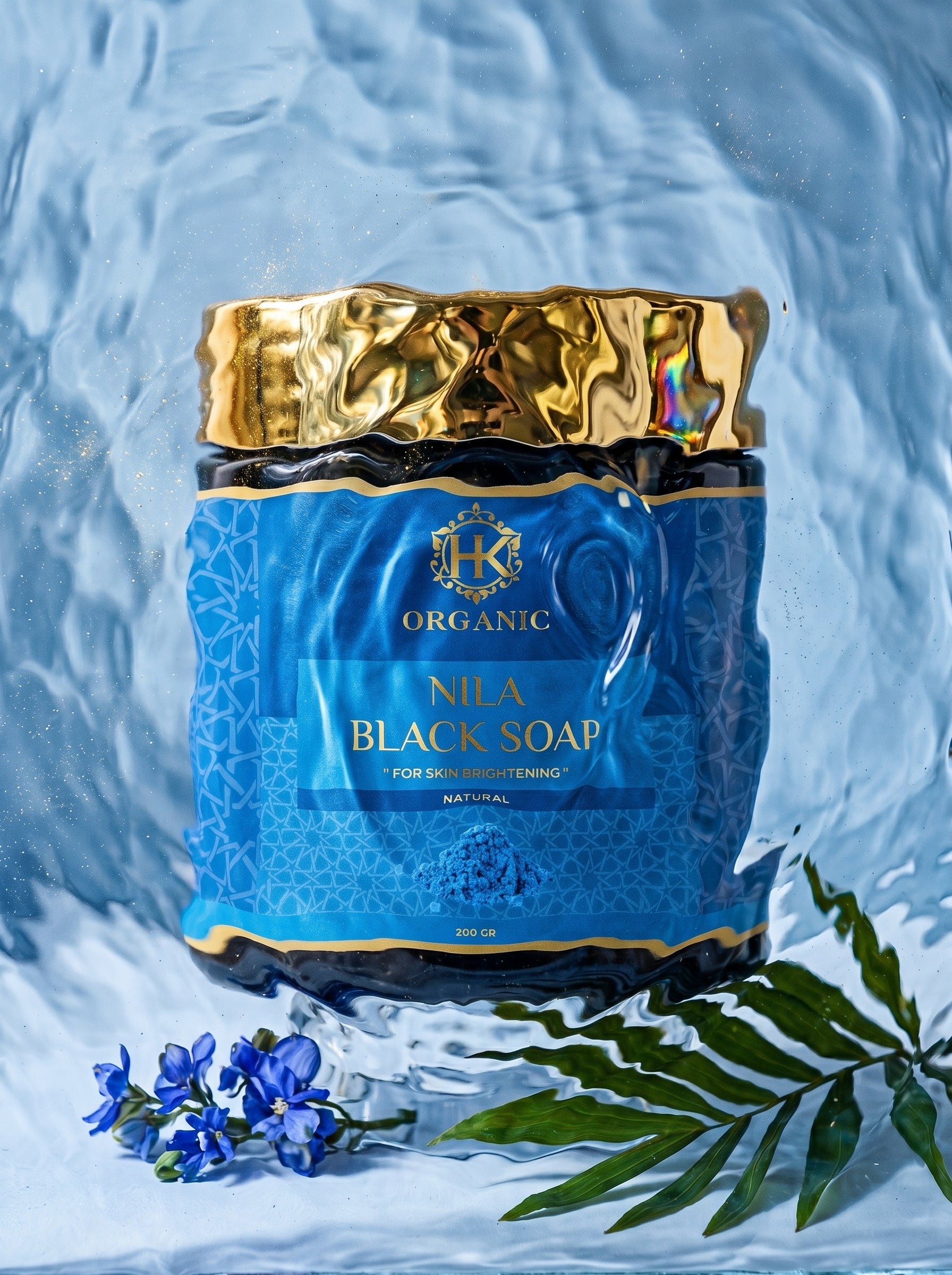 Nila Black Soap packaging with gold and blue design on a textured white background