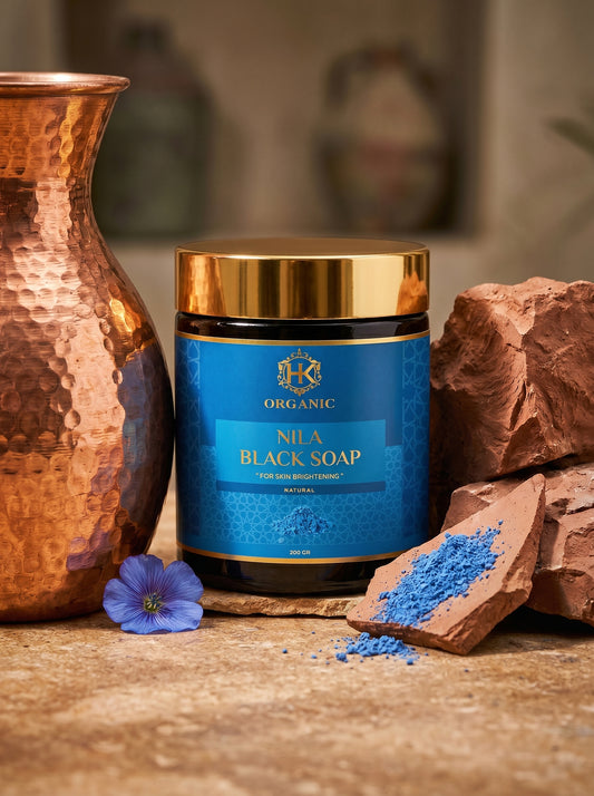 Jar of Nila Black Soap with decorative elements on a wooden surface