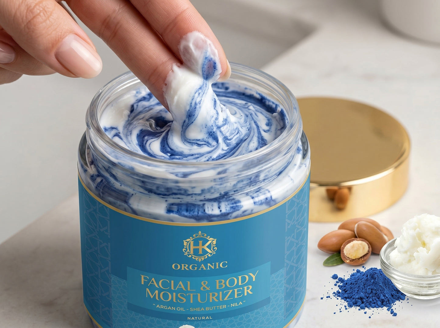 Hand scooping moisturizer from a jar labeled 'Organic Facial & Body Moisturizer' with ingredients visible in the background.