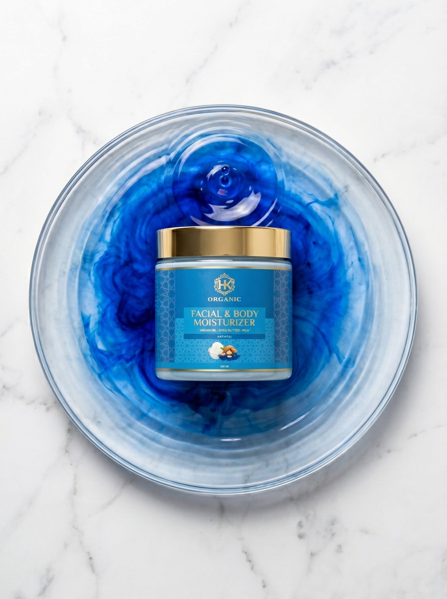 Facial and body moisturizer jar with blue cream on a marble surface