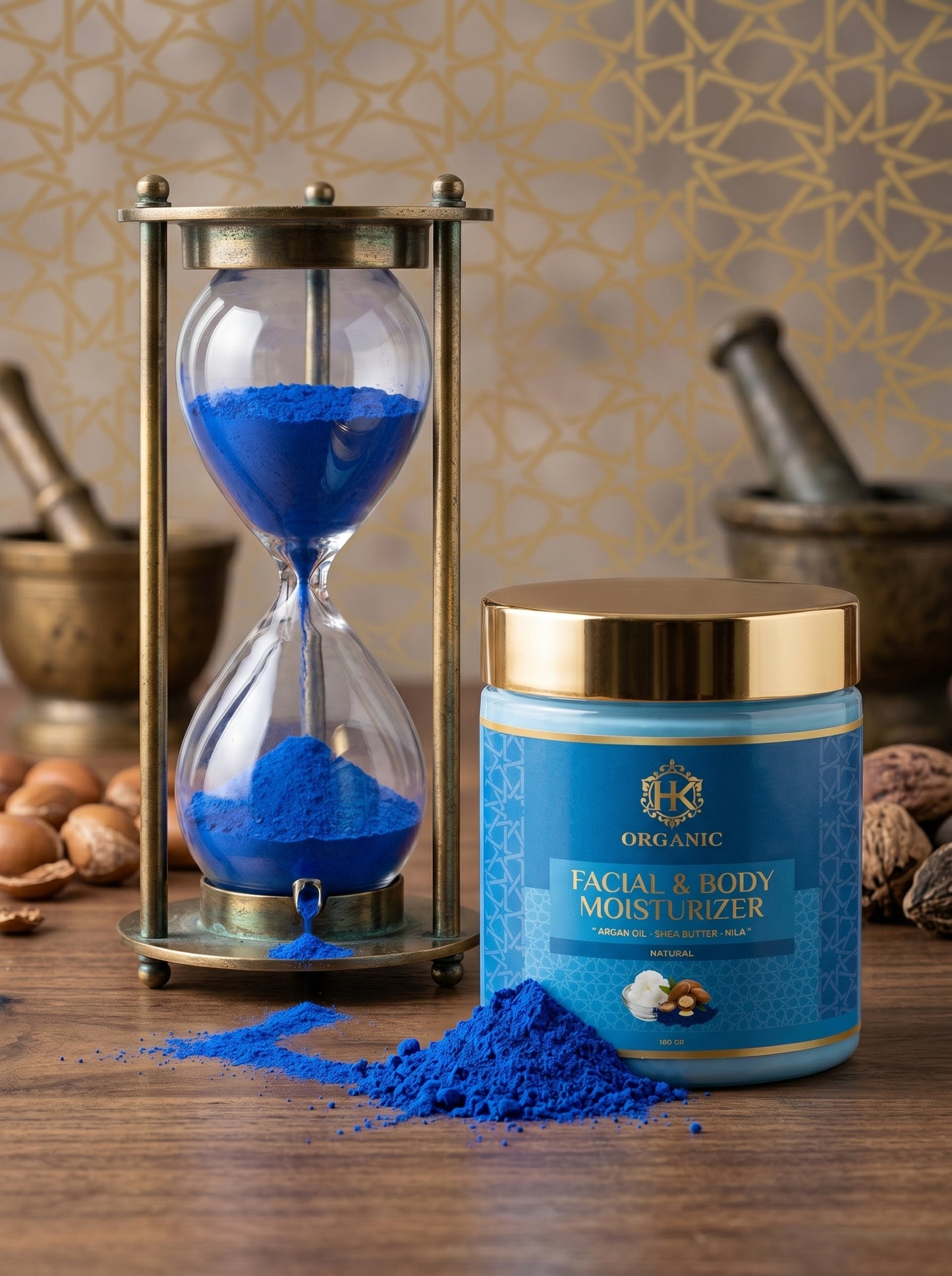 Blue facial and body moisturizer jar with hourglass and blue powder on a wooden surface.