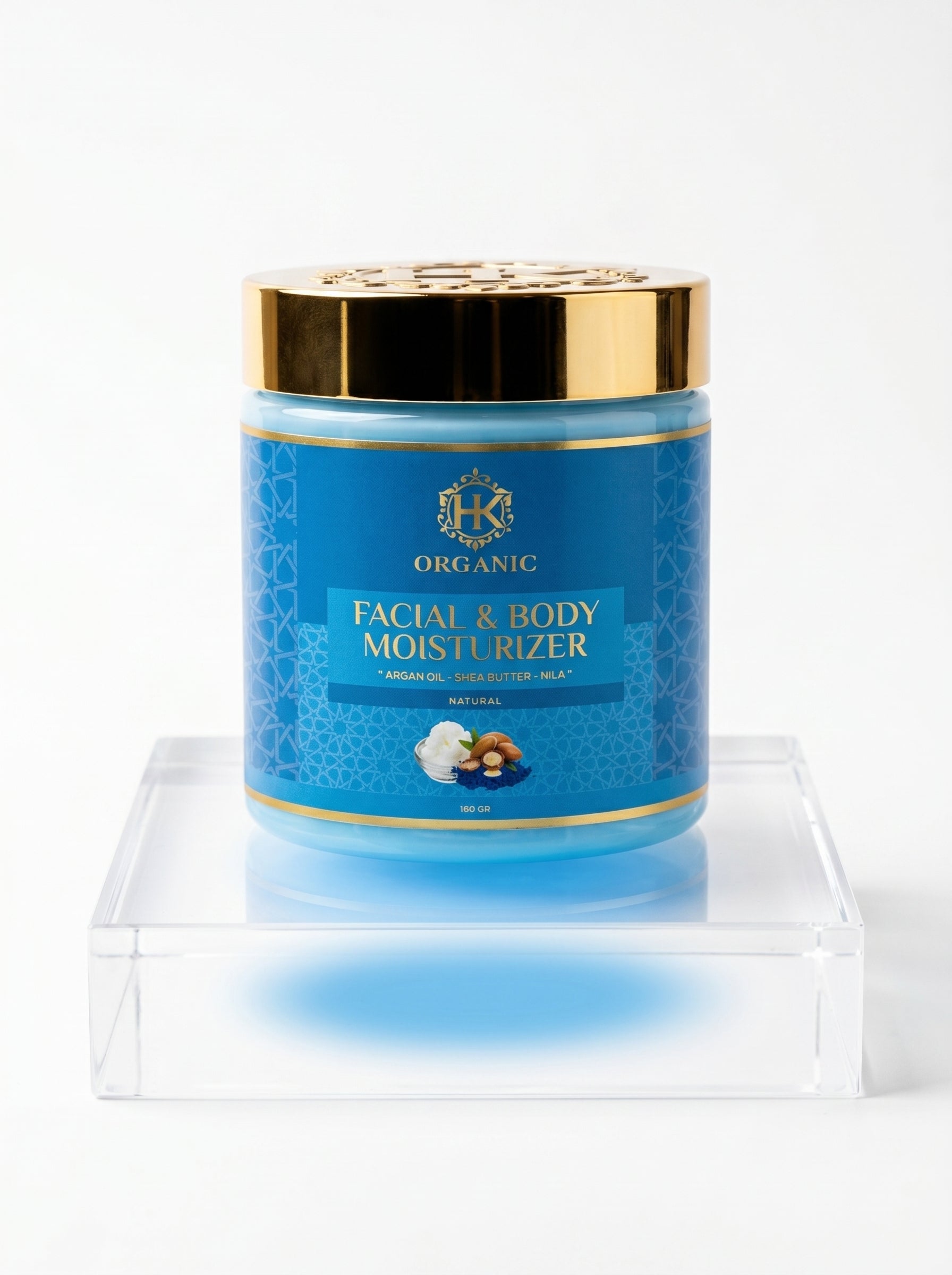 Blue jar of facial and body moisturiser with gold lid on a white background