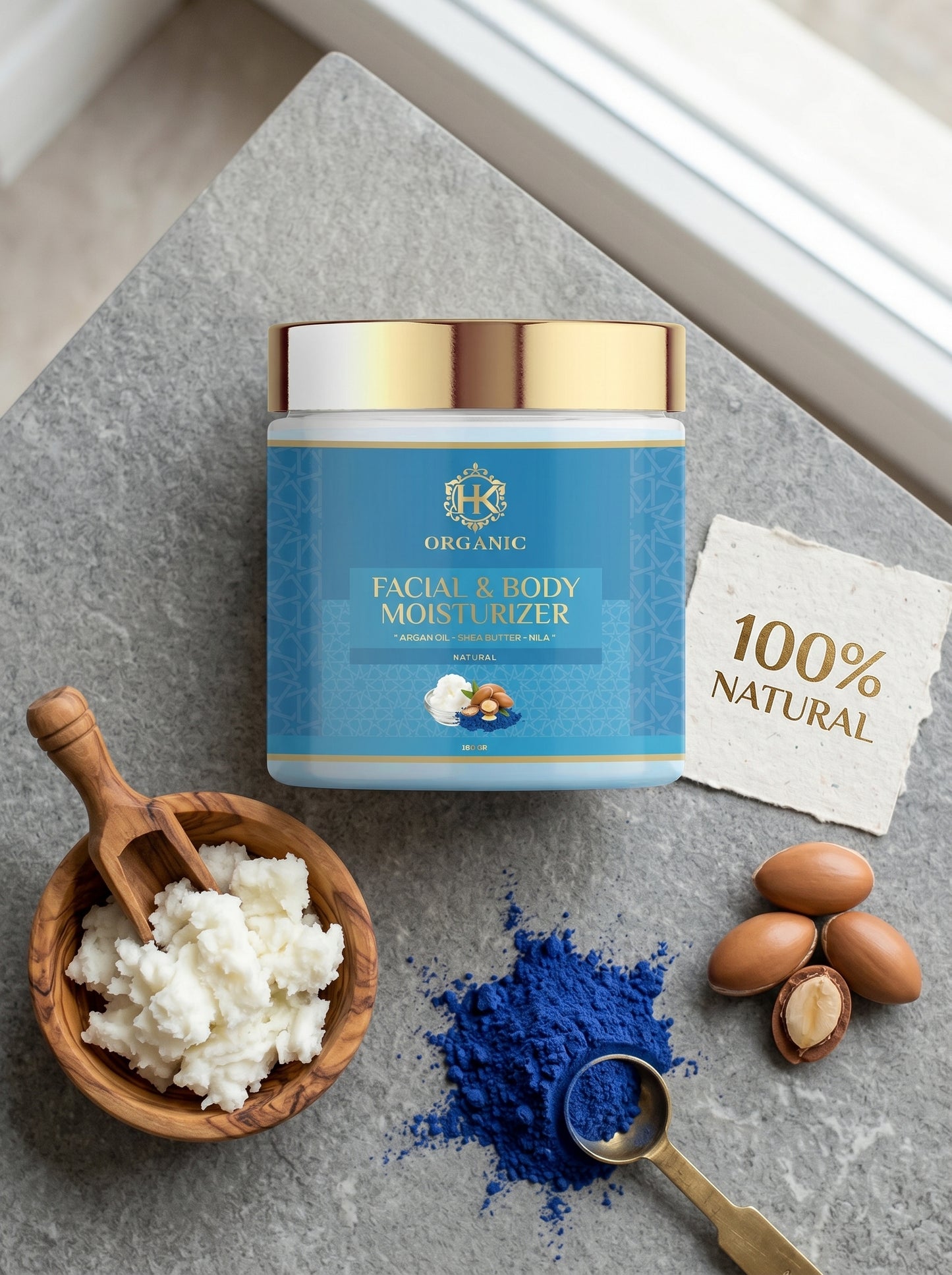 Facial and body moisturizer jar with natural ingredients on a gray surface