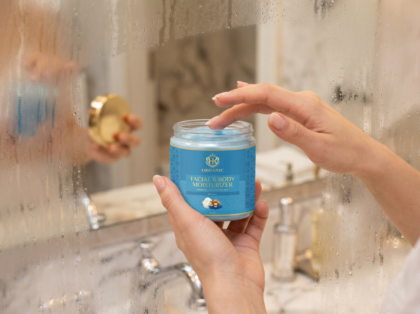 Person holding a jar of face cream in front of a bathroom mirror