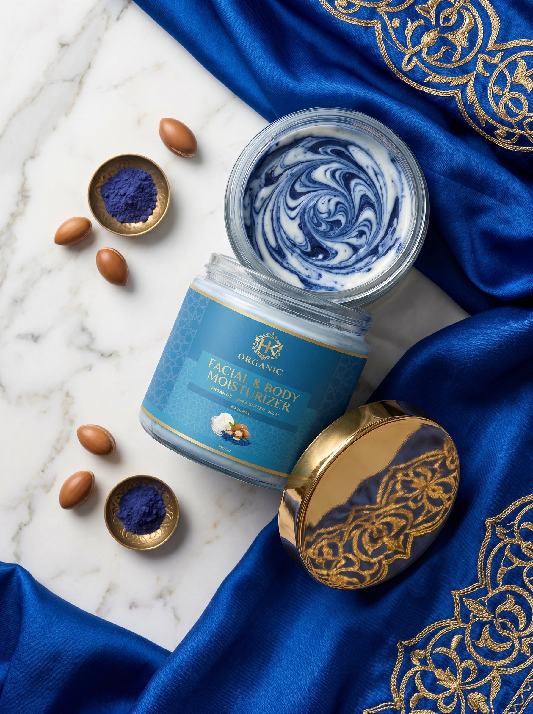 Jar of face and body scrub with decorative elements on a blue fabric background