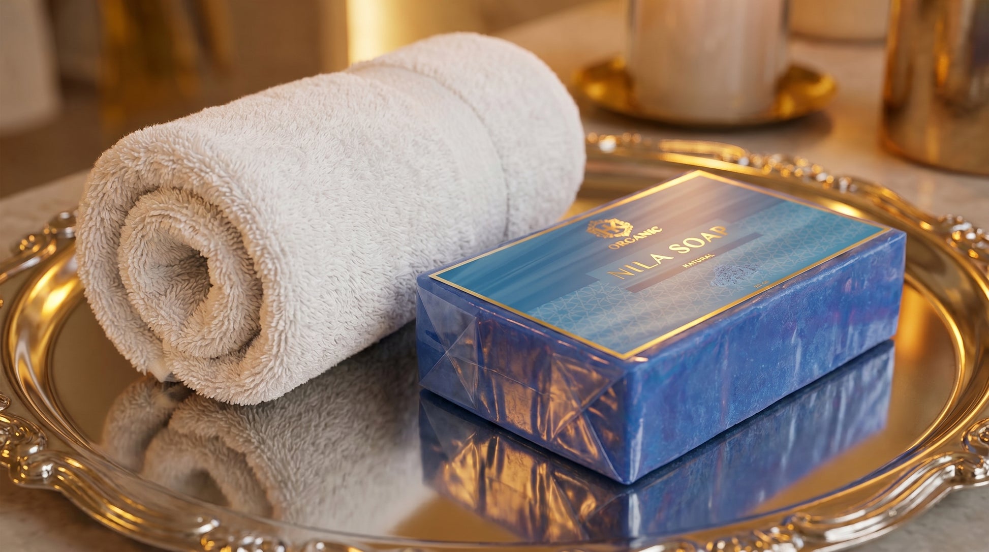 Rolled towel and blue soap bar on a metallic tray