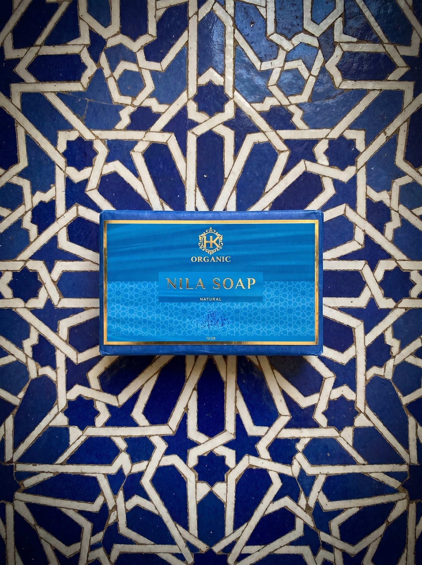 Nila Soap bar packaging on a blue and white patterned tile background