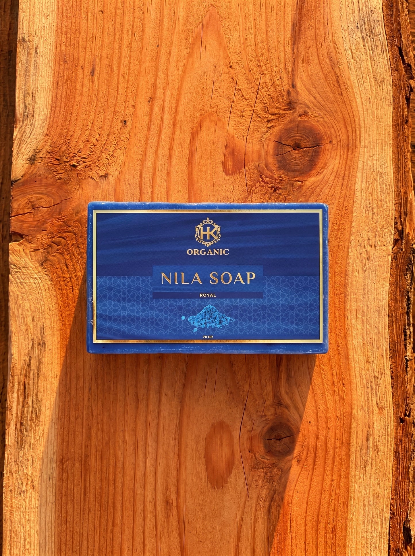 Nila Soap packaging on a wooden surface