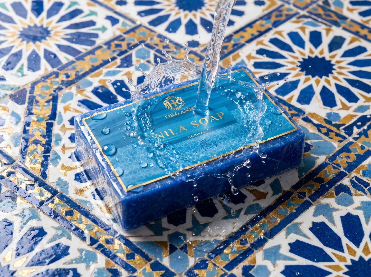 Blue soap bar with clear packaging on a decorative tile background