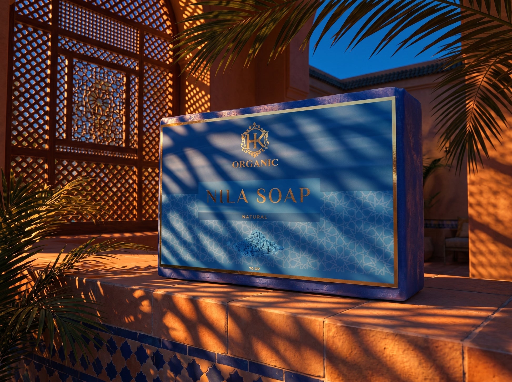 Box of organic sea soap with decorative patterns and plants in the background