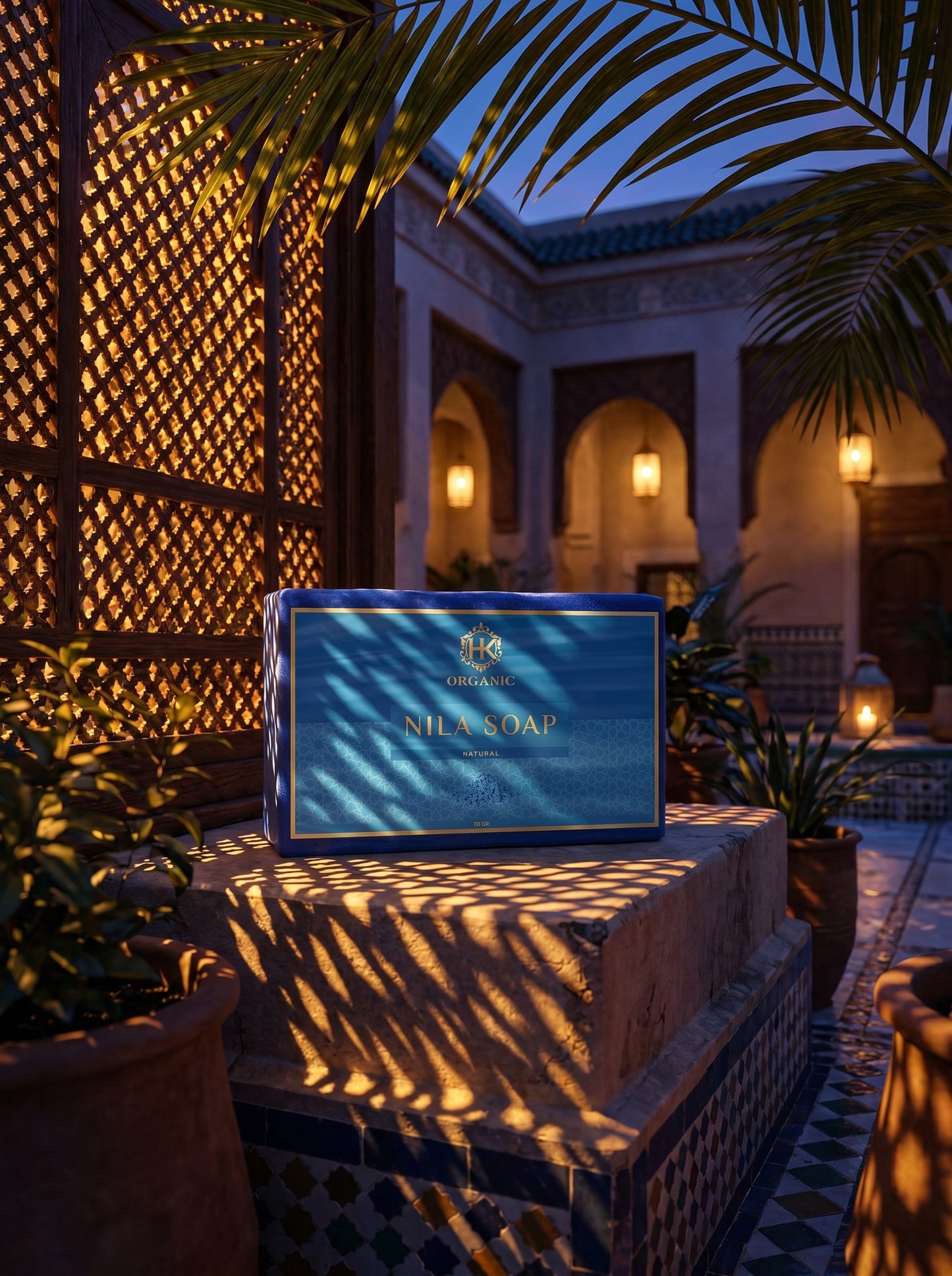 Nila Soap packaging on a stone surface with decorative architecture and plants in the background