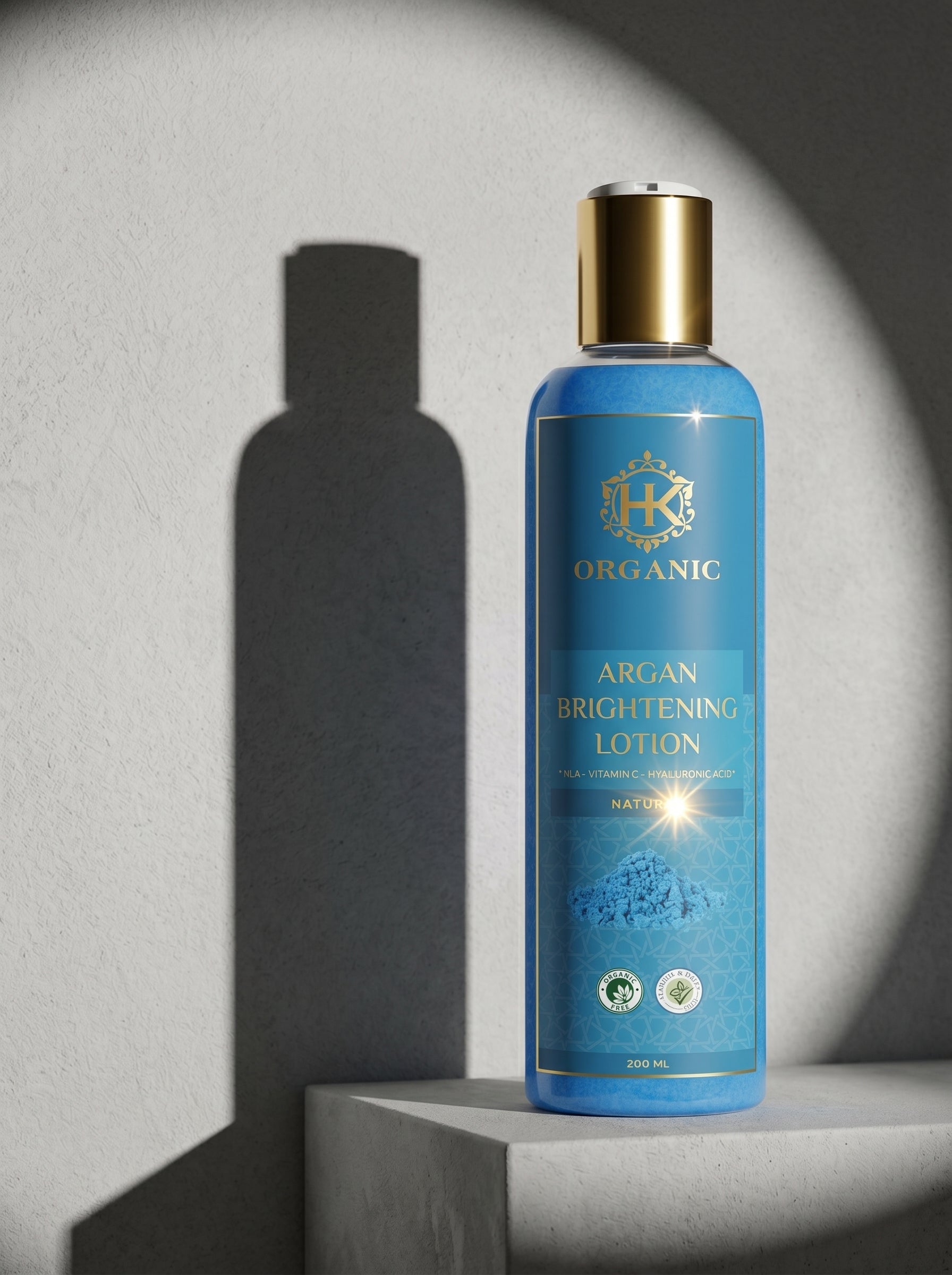 Blue bottle of HK Organic Argan Brightening Lotion on a gray background