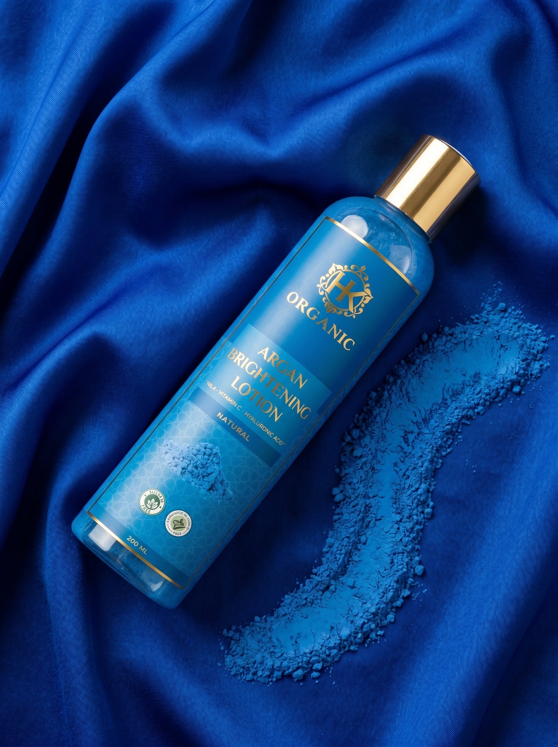 Blue bottle of organic skin care product on blue fabric