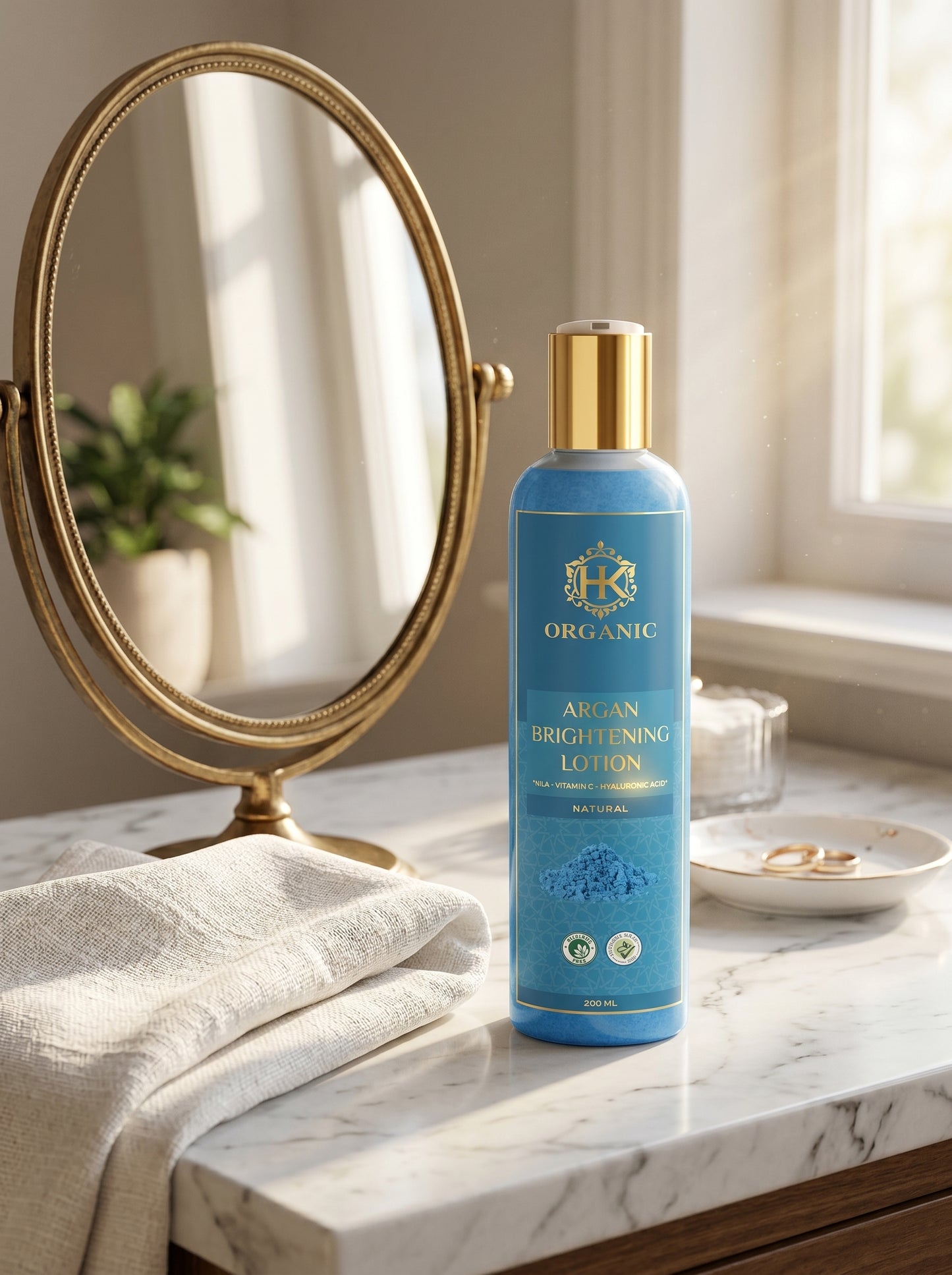 Blue bottle of Argan Brightening Lotion on a marble surface with a gold mirror.