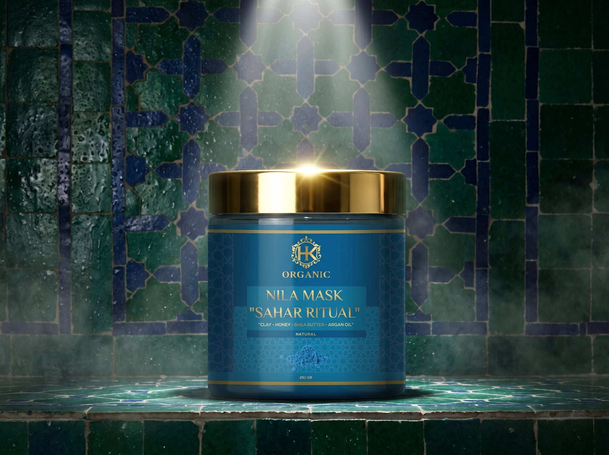Blue mask container with gold lid on a green tiled background