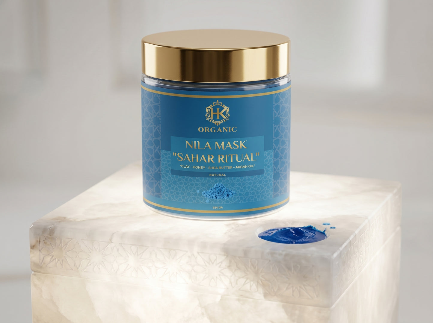 Blue jar of Nila Mask on a marble surface with a white background