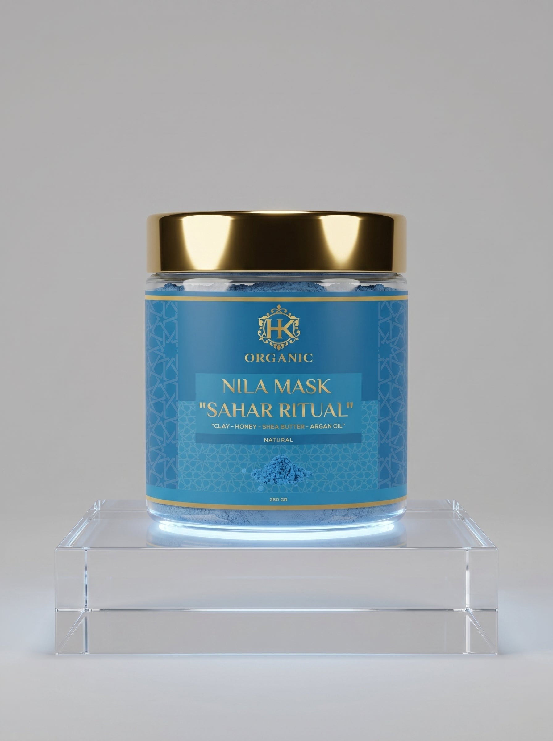 Blue jar with gold lid on a gray background