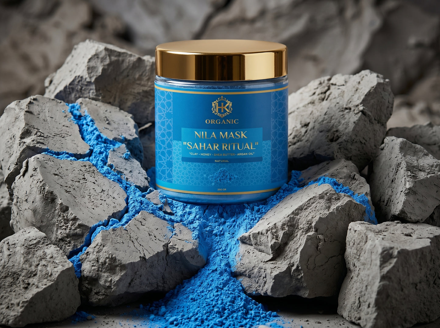 Blue mask jar with gold lid on gray rocks