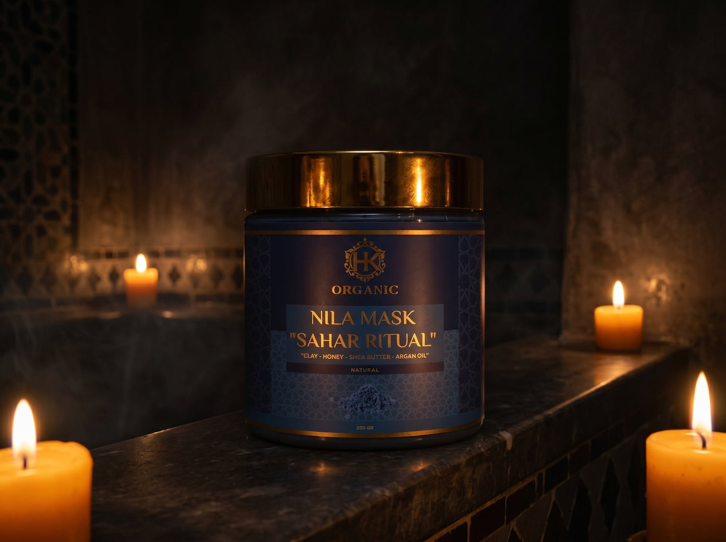 Blue jar labeled 'Nila Mask Sahar Ritual' on a dark surface with candles in the background
