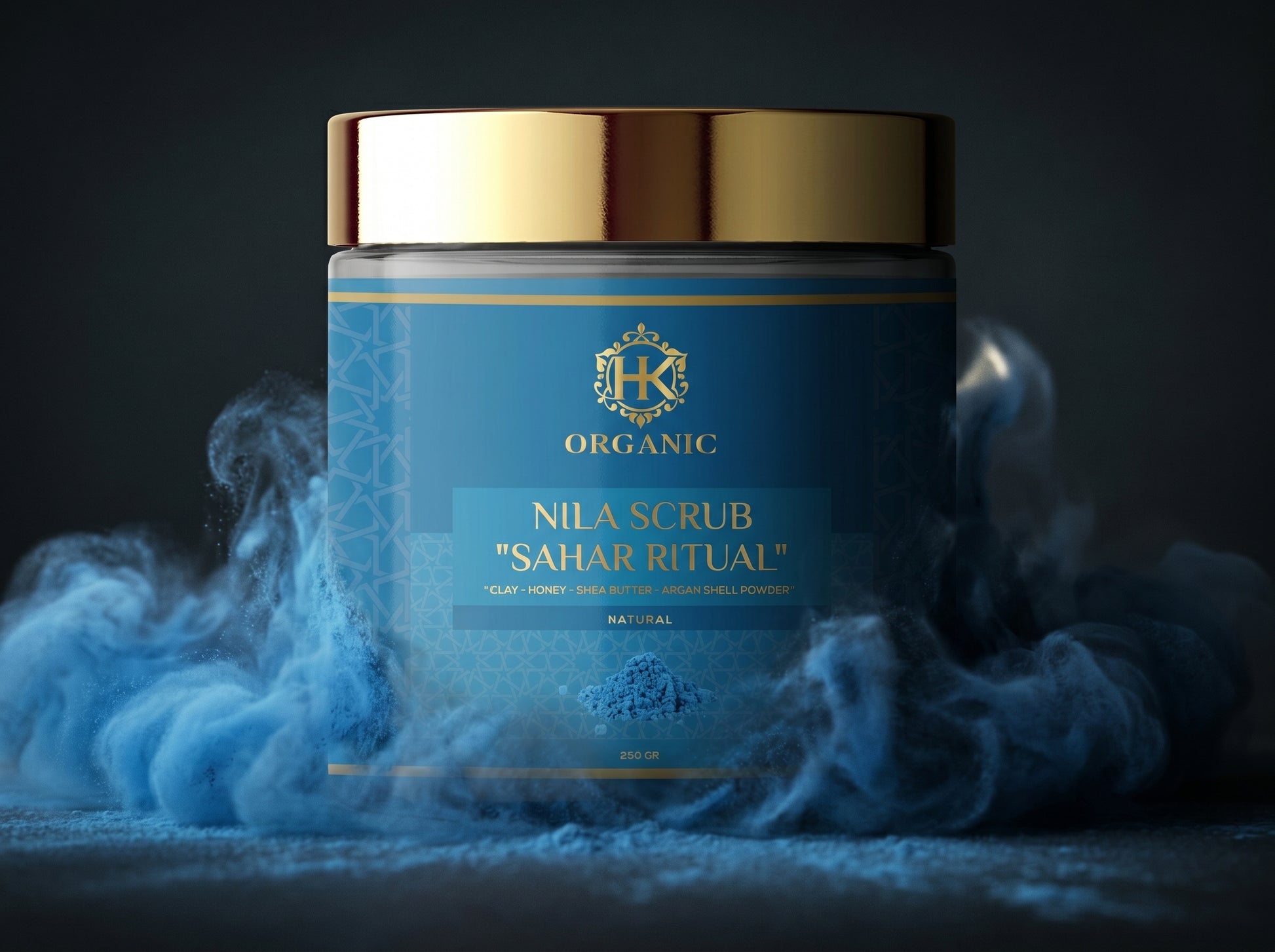 Blue jar of Nila Scrub with gold lid on a dark background