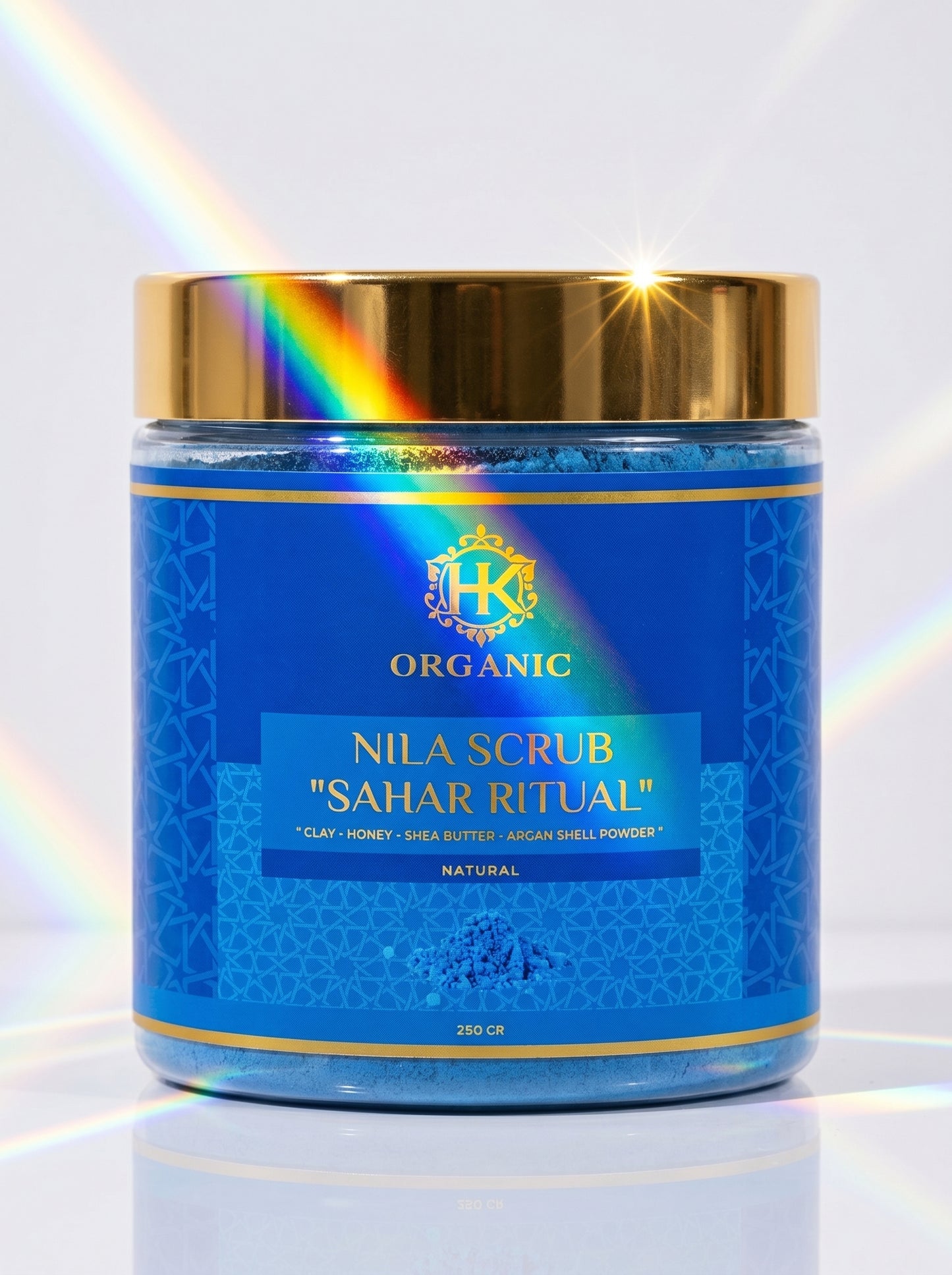 Blue jar of Nila Scrub 'Sahar Ritual' with gold lid on a white background