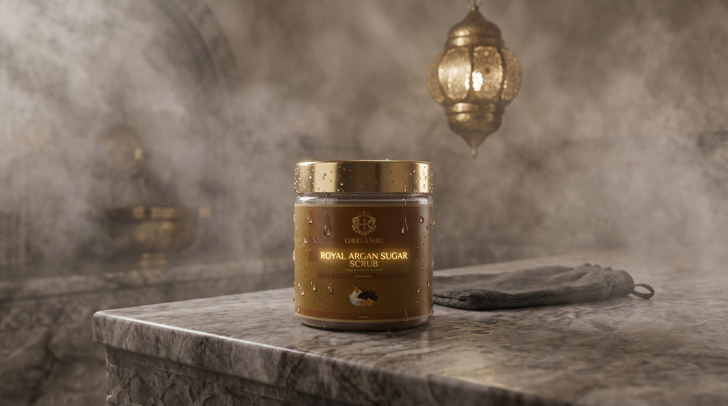 Jar of Royal Argan Sugar on a marble surface with a decorative lamp in the background