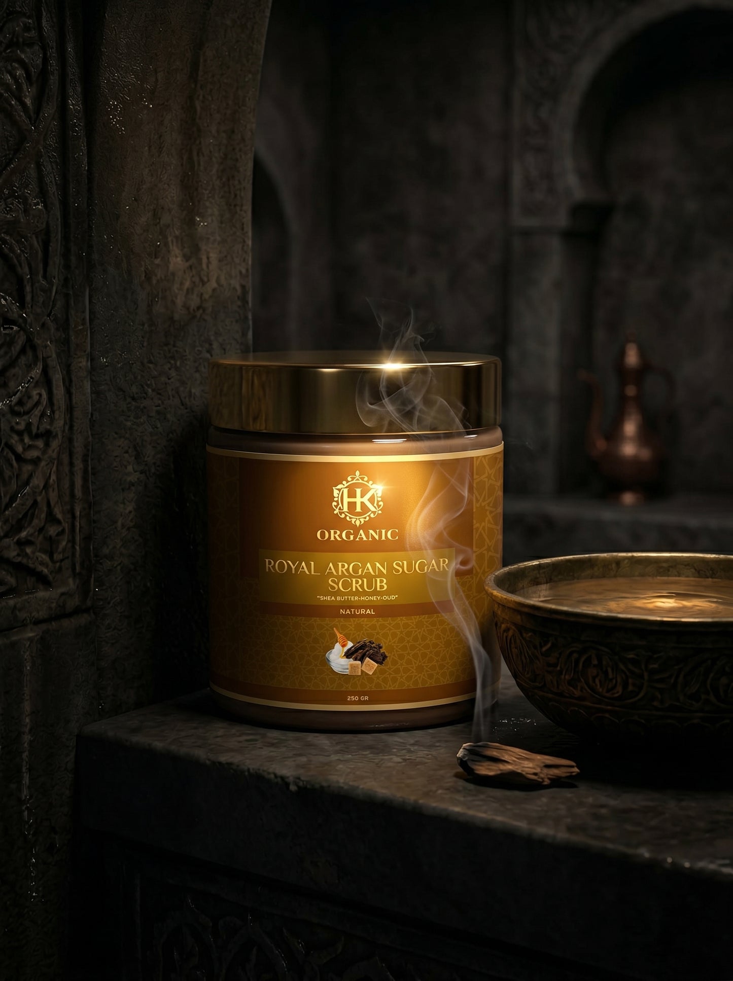 Jar of organic royal argan sugar scrub with smoke effect on a dark background