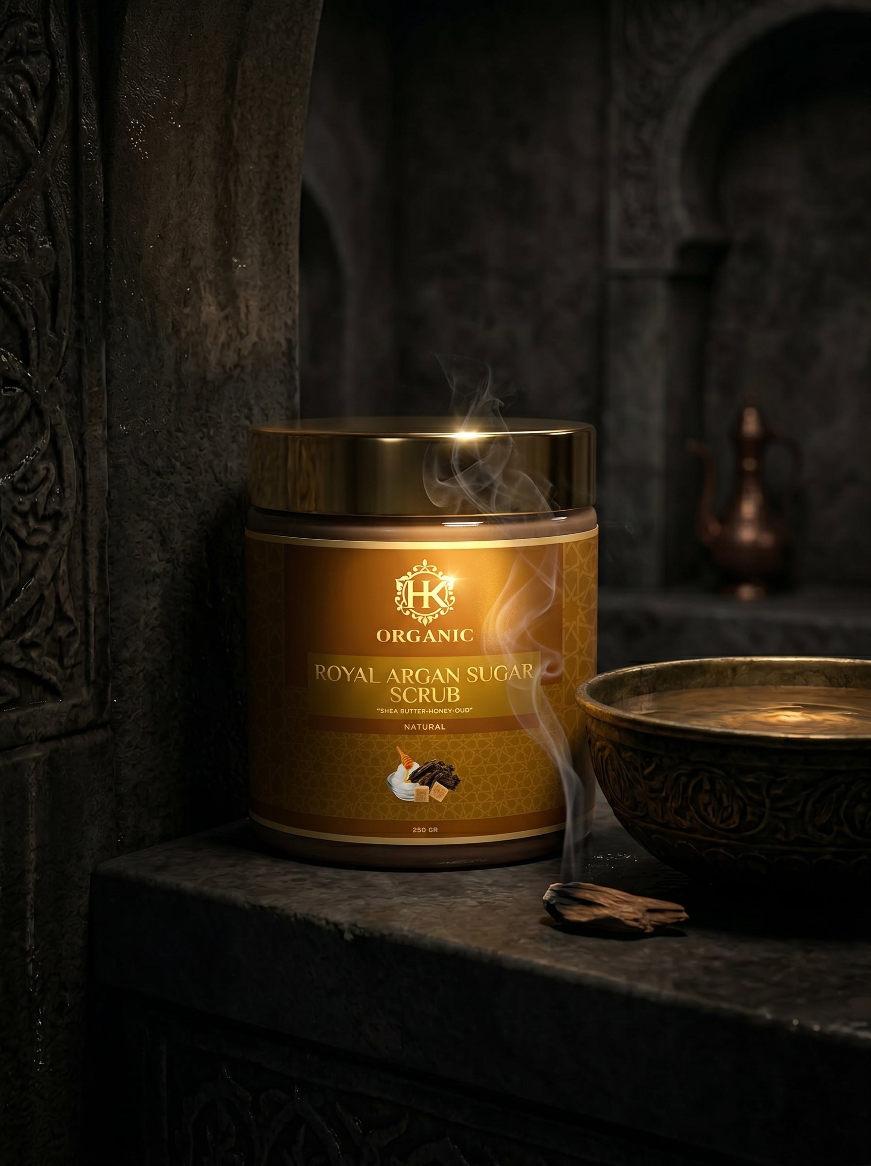 Jar of organic royal argan sugar scrub with smoke effect on a dark background
