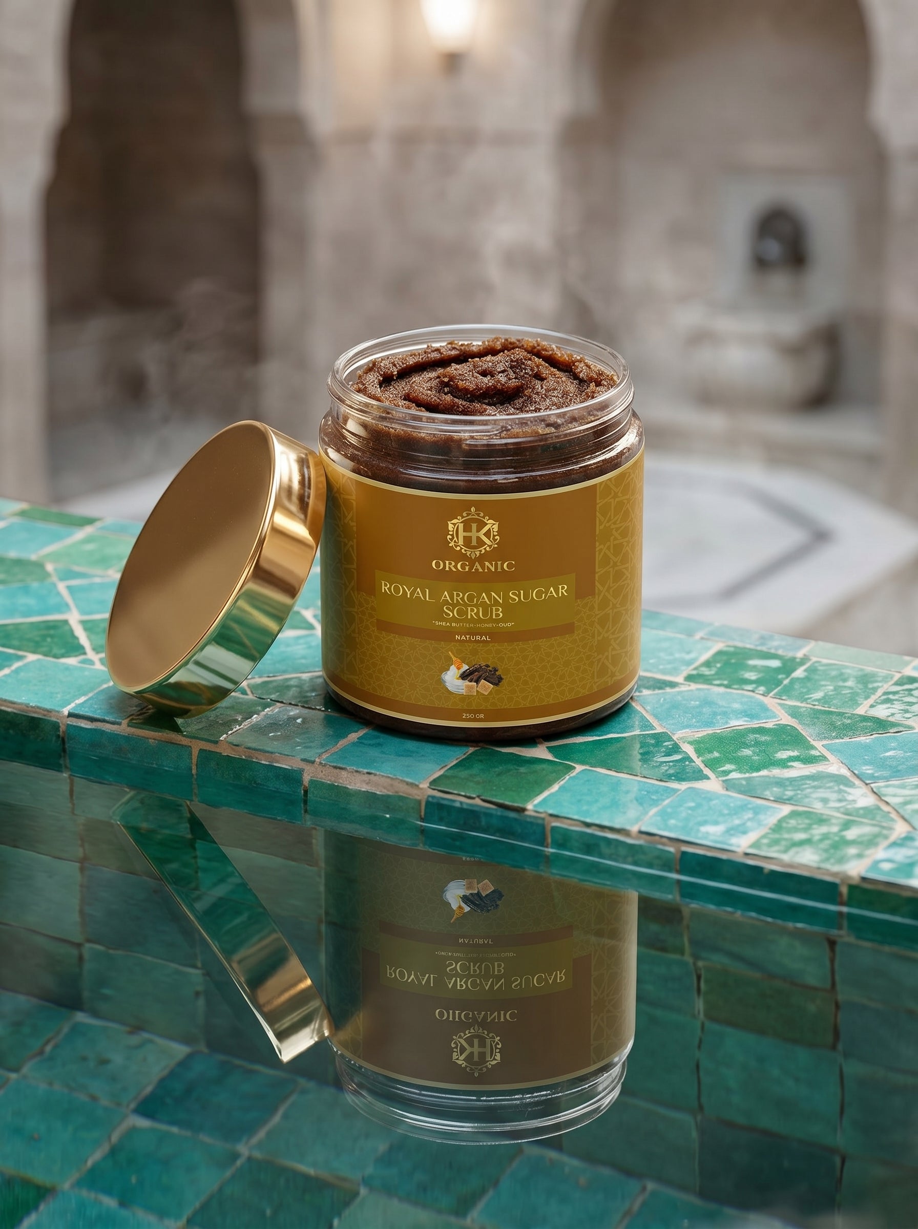Jar of Royal African Sugar Scrub on a mosaic tile surface with a blurred background