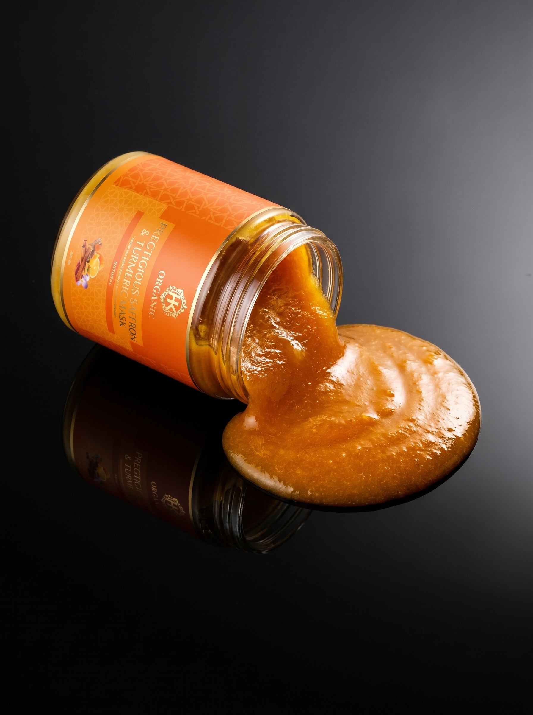 Jar of turmeric with a dark background