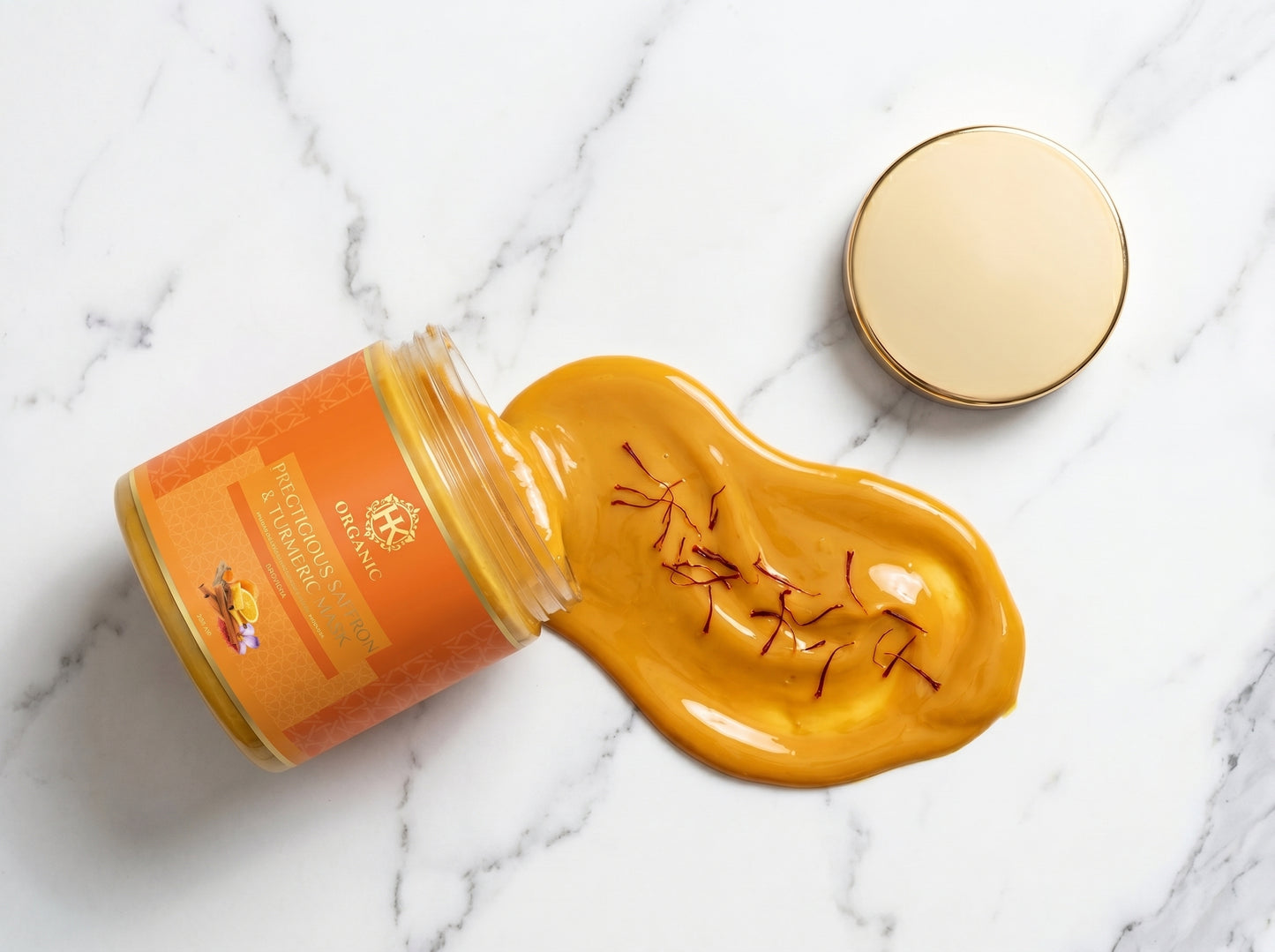 Jar of saffron with a spoonful of saffron on a marble surface