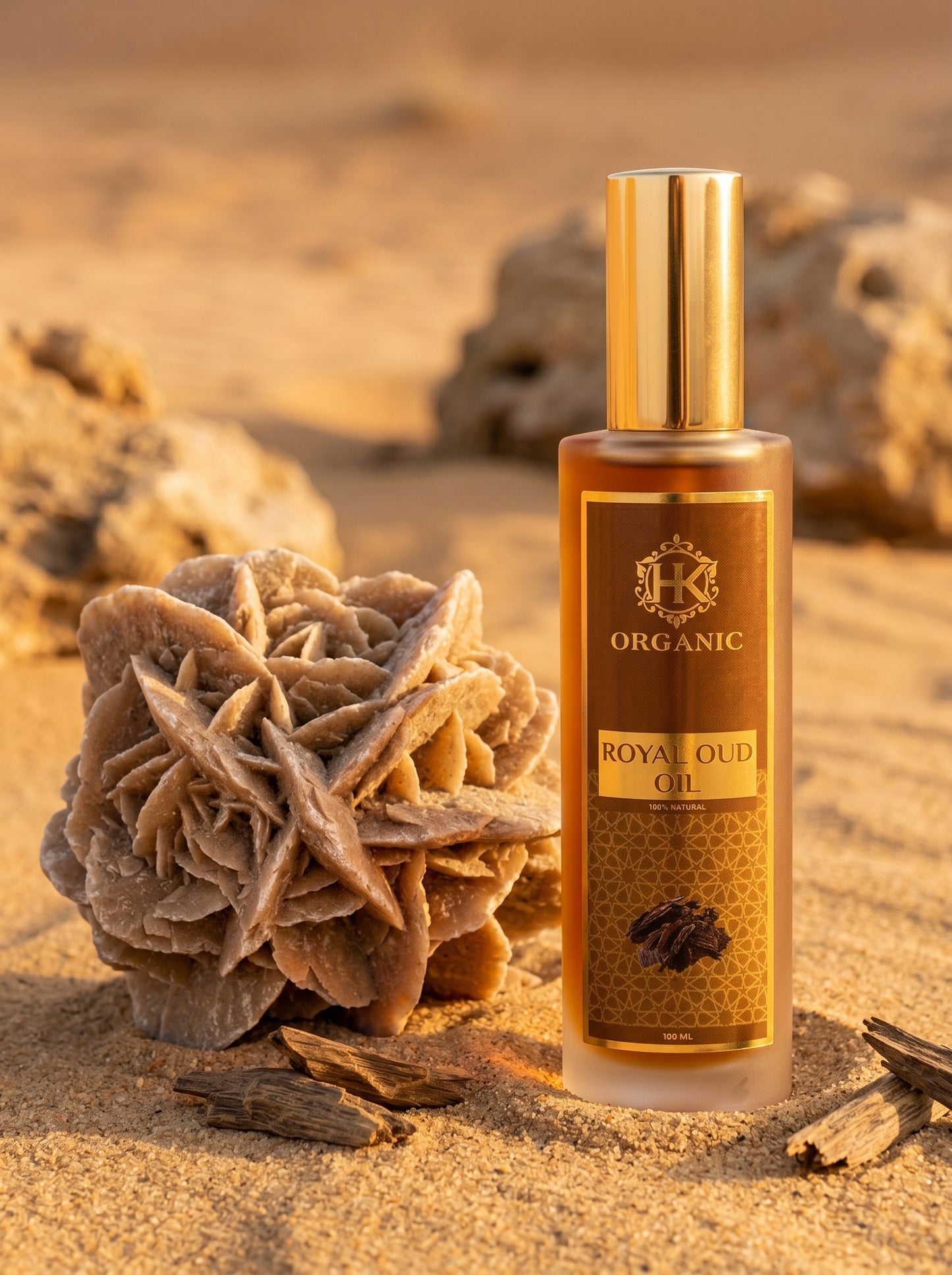 Bottle of Royal Oud Oil with gold cap on sand and desert background