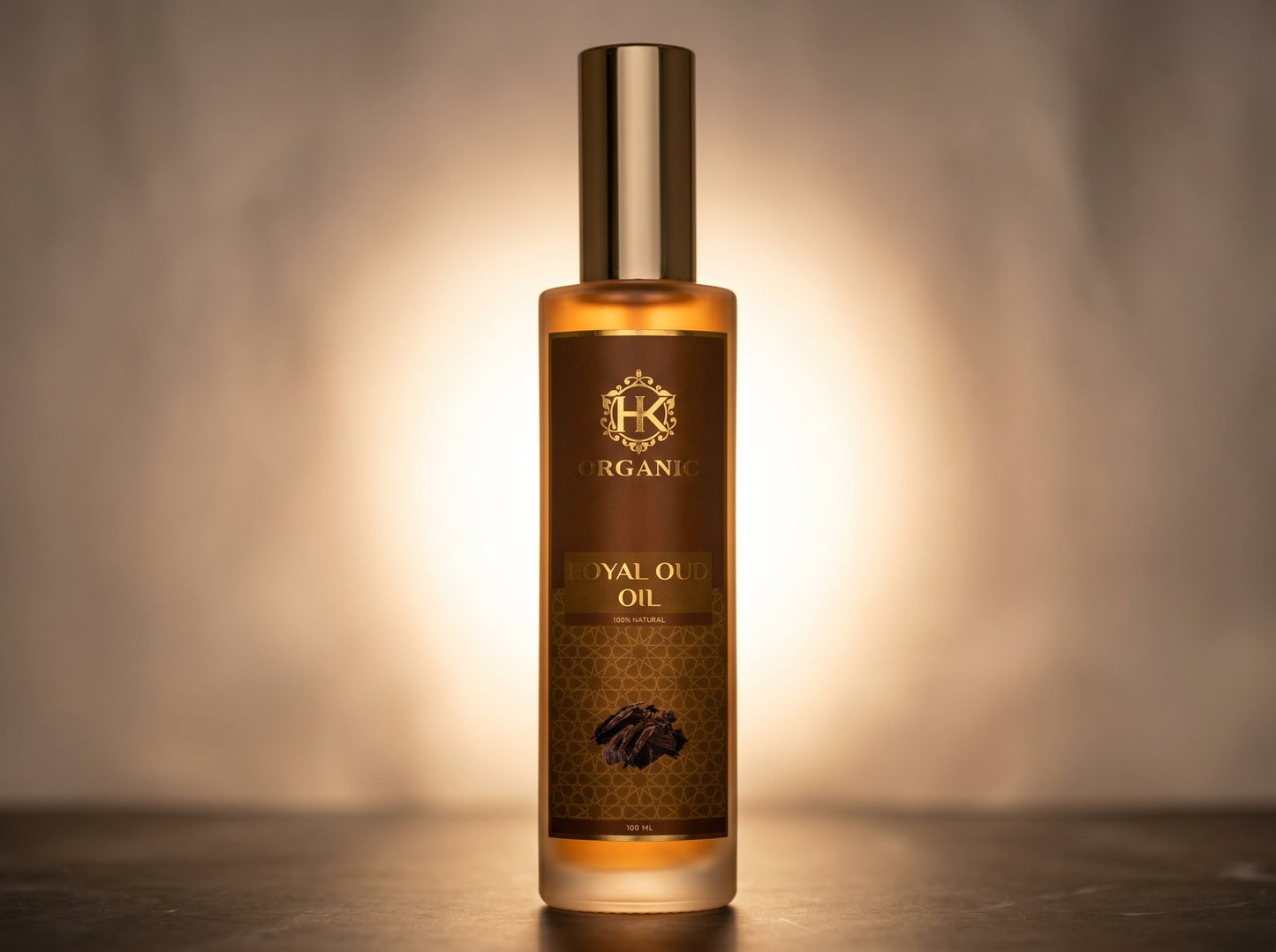 Bottle of organic royal oil with a dark label on a reflective surface.