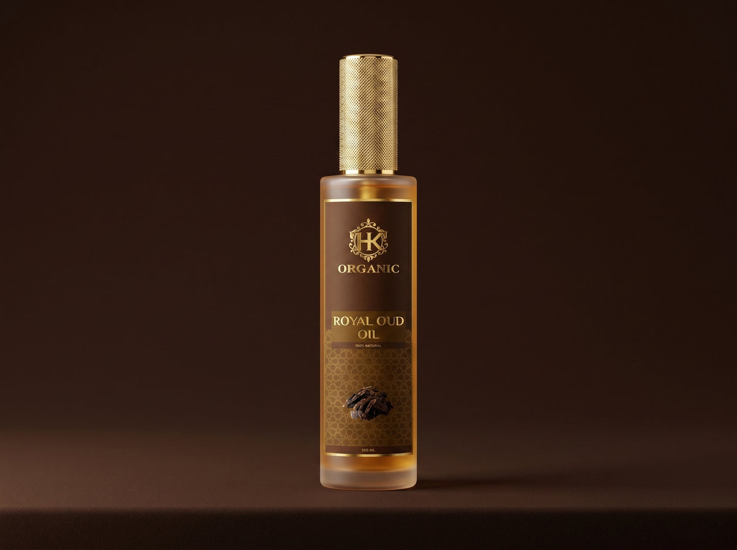 Bottle of organic royal oud oil with a gold cap on a dark background
