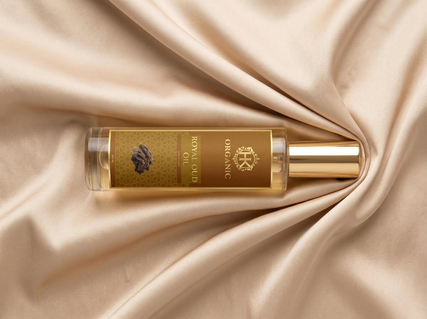 Gold bottle of organic royal oil on beige fabric