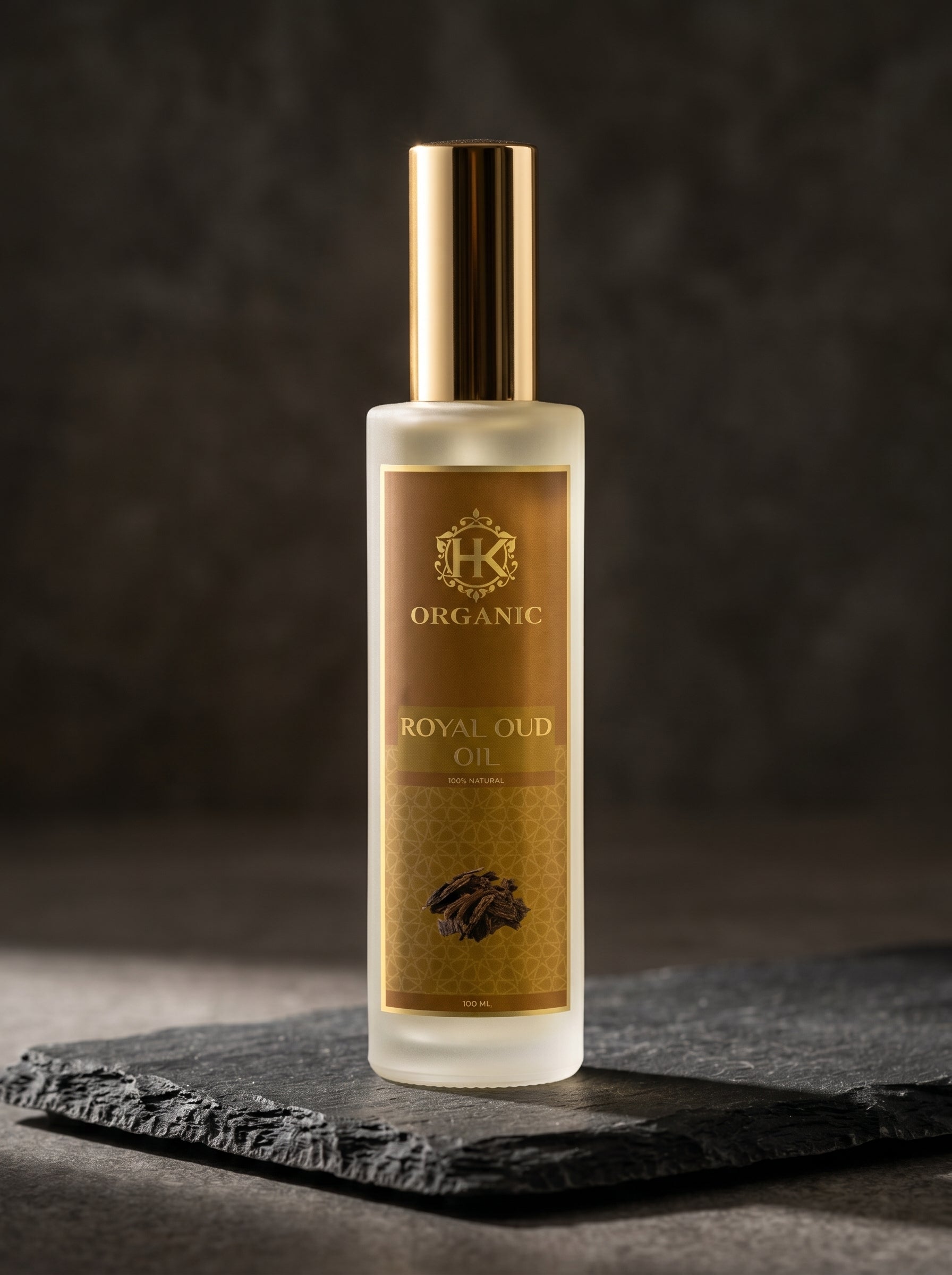 Bottle of Royal Oud oil with a gold label on a dark background