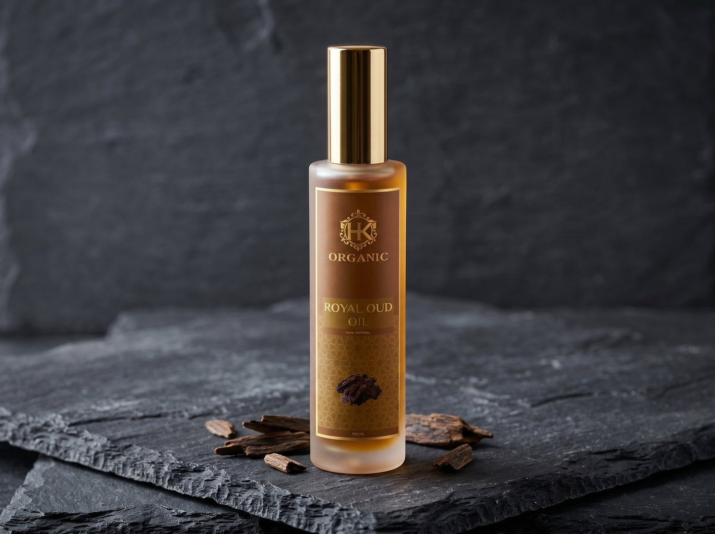 Bottle of organic royal oil on a dark slate surface with a dark background