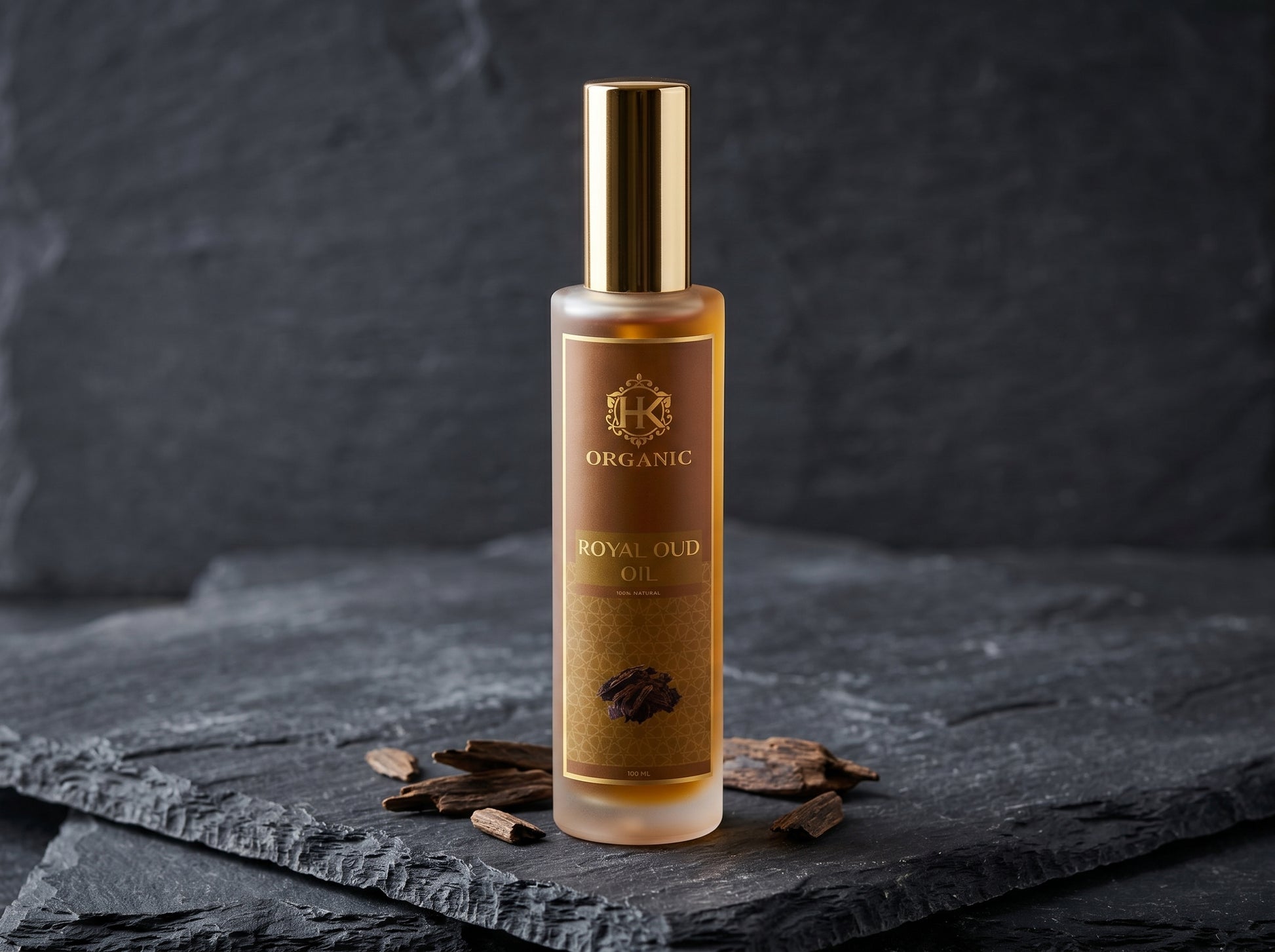 Bottle of organic royal oil on a dark slate surface with a dark background