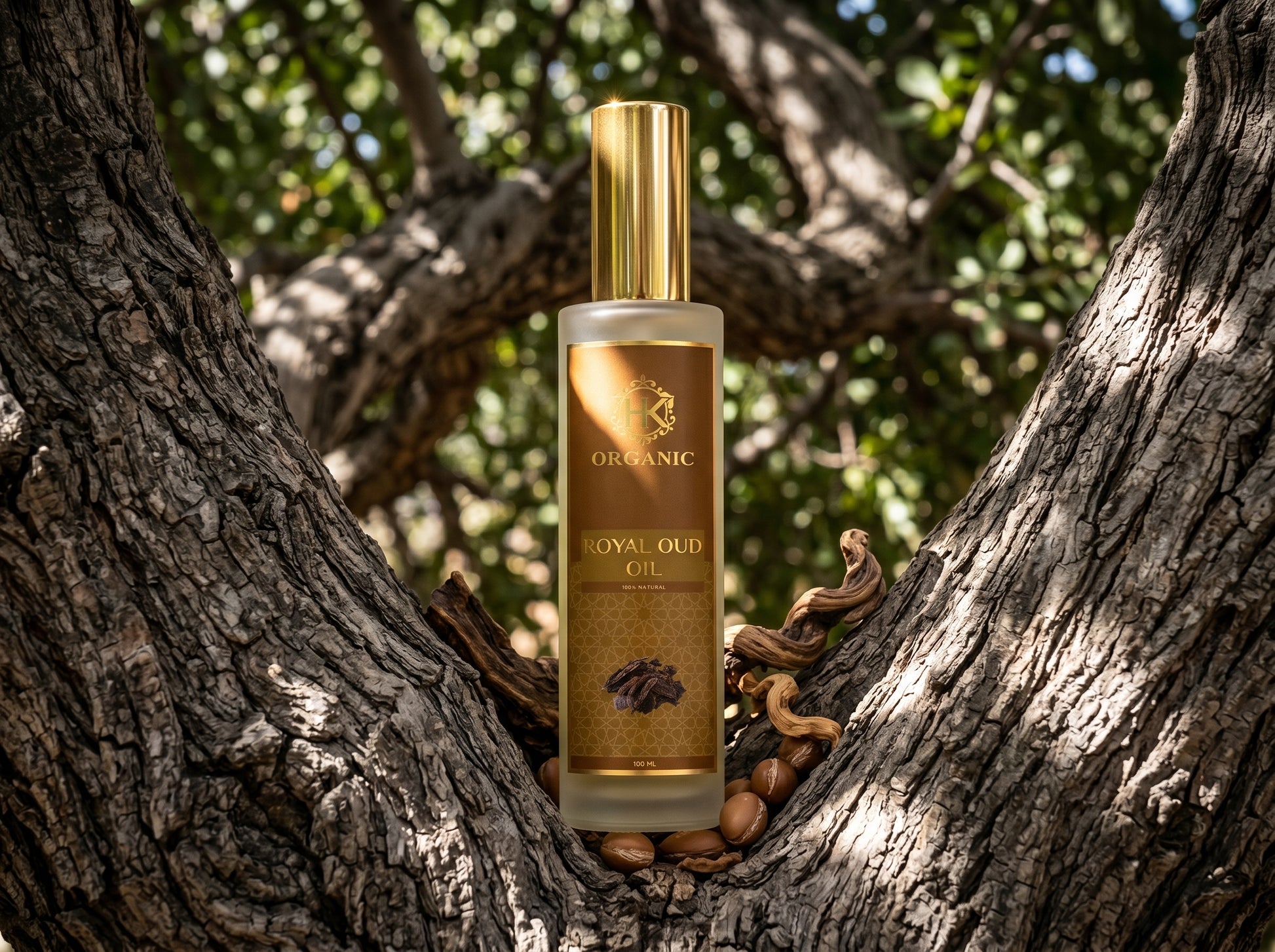 Bottle of Organic Oud Oil on a tree trunk with leaves in the background