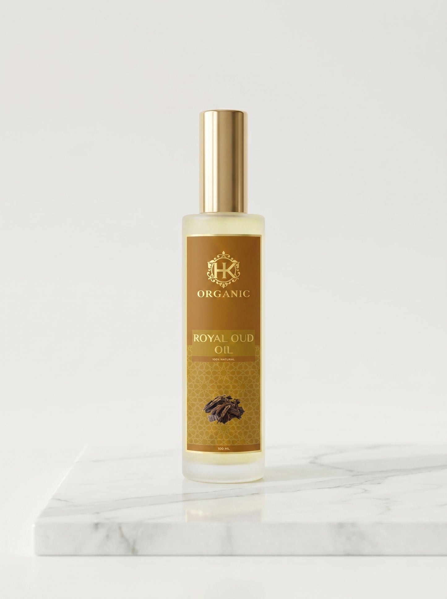 Bottle of Royal Oud Oil on a marble surface with a white background