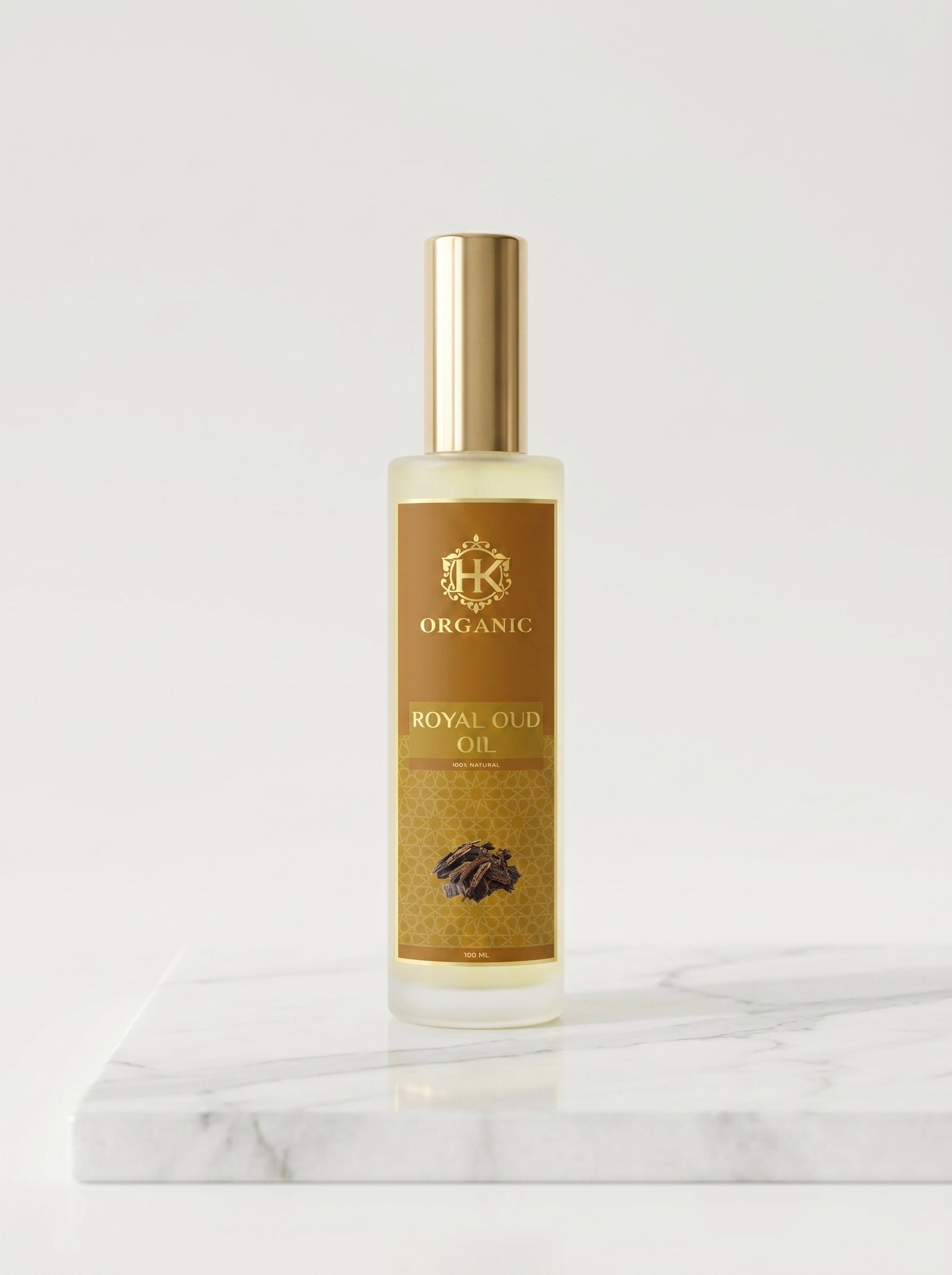 Bottle of Royal Oud Oil on a marble surface with a white background