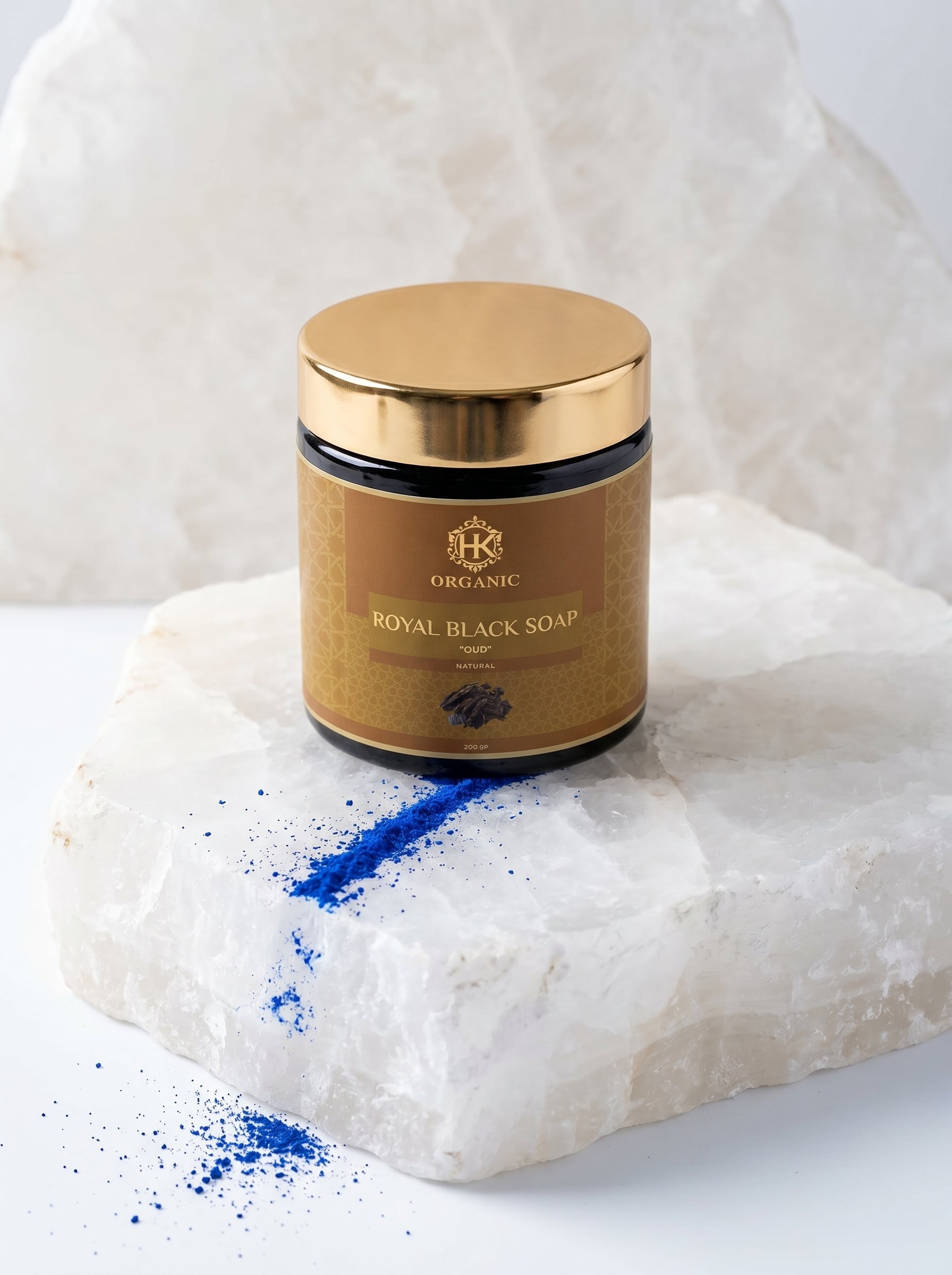 Jar of Royal Black Soap with gold lid on a white background