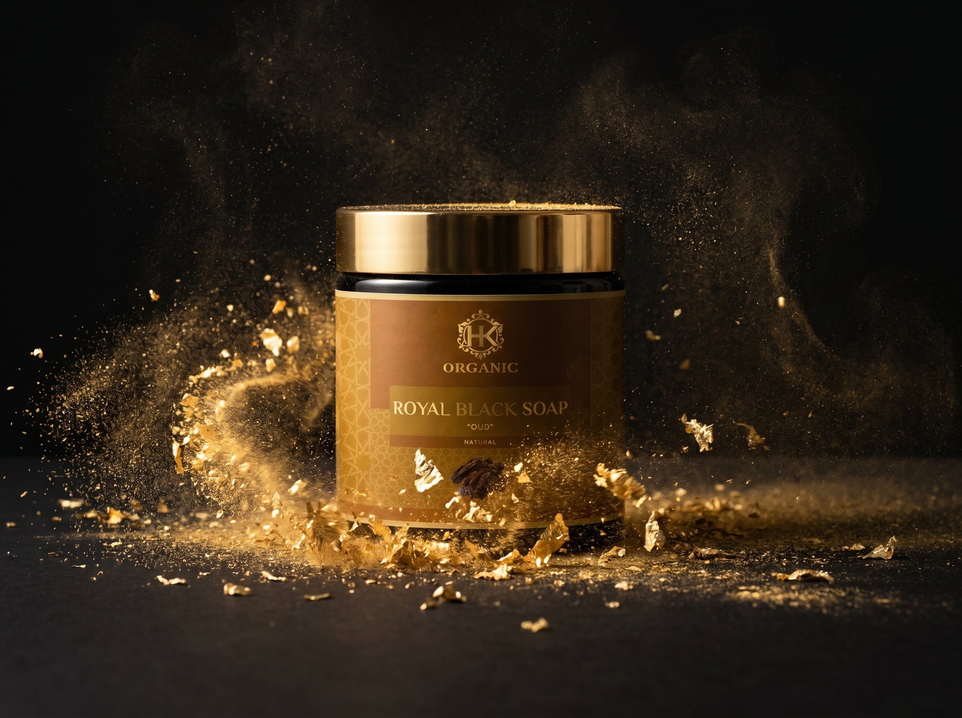 Jar of Royal Black Soap with gold lid on a dark background