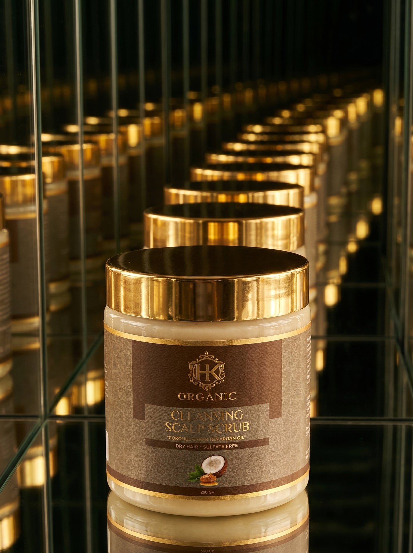 Jar of HK Organic Cleansing Scalp Scrub with gold lid on a reflective surface
