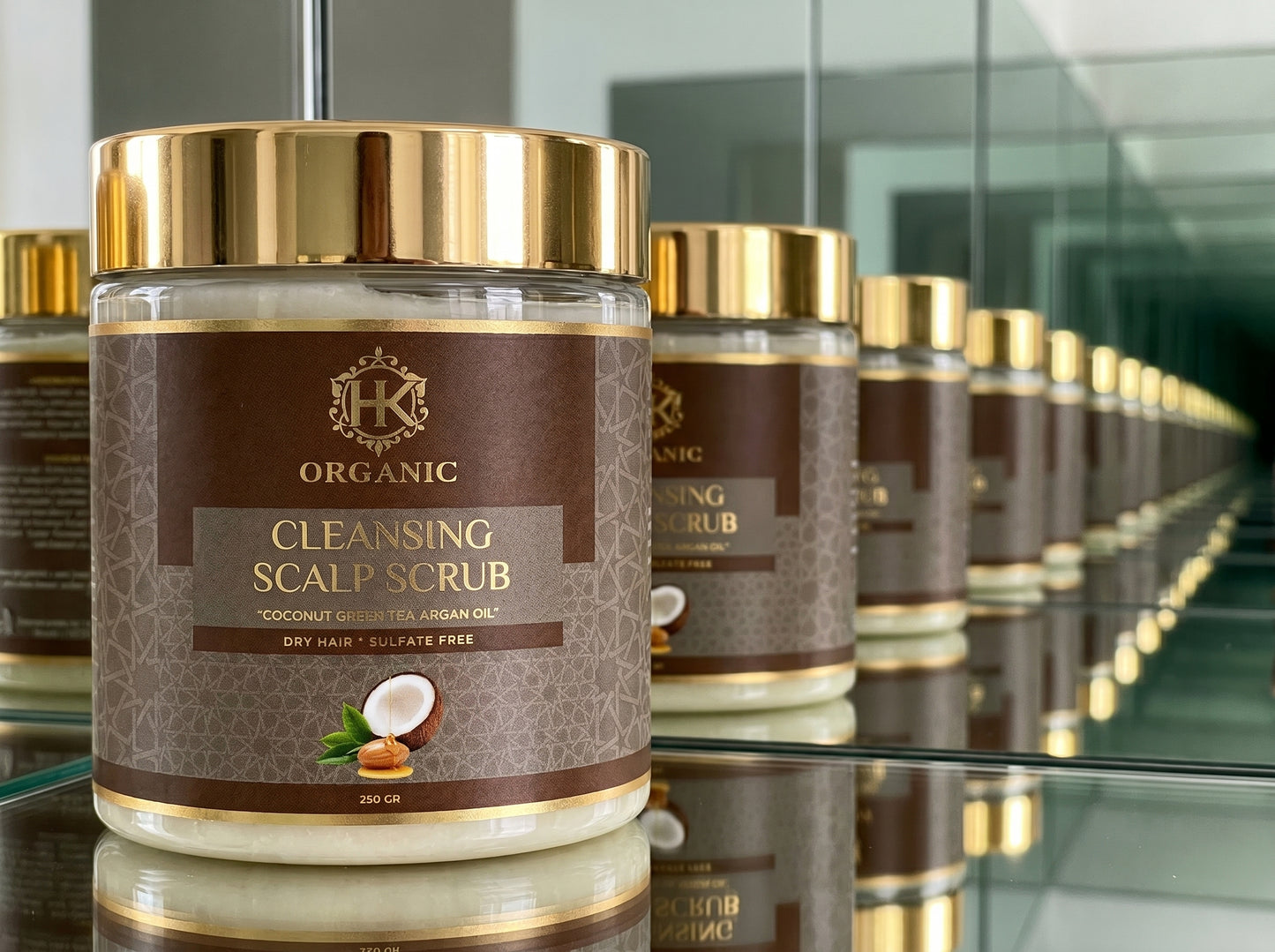 Jar of organic cleansing scalp scrub with gold lid on a reflective surface