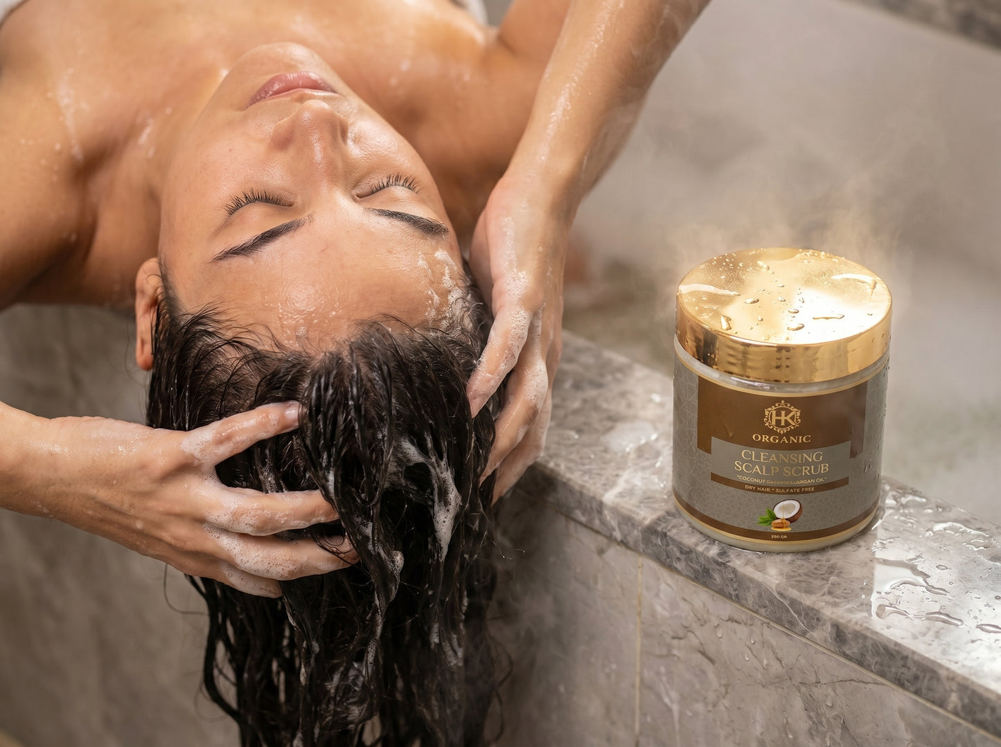 Person washing hair with a jar of organic hair product on a bathroom counter.